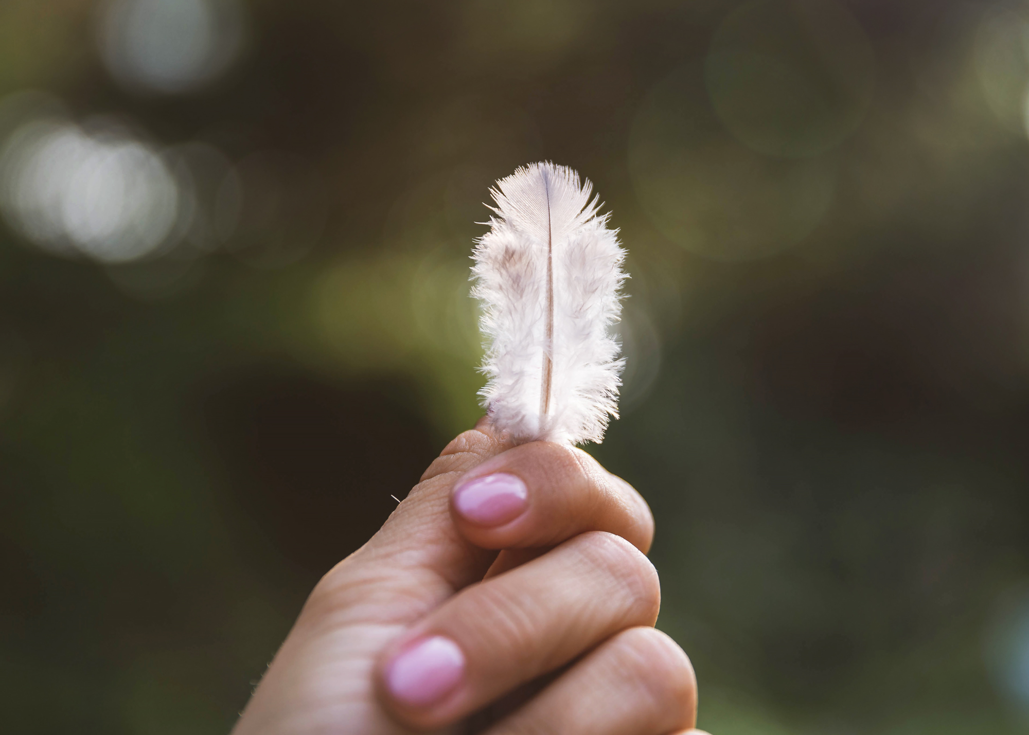 holding feather.png