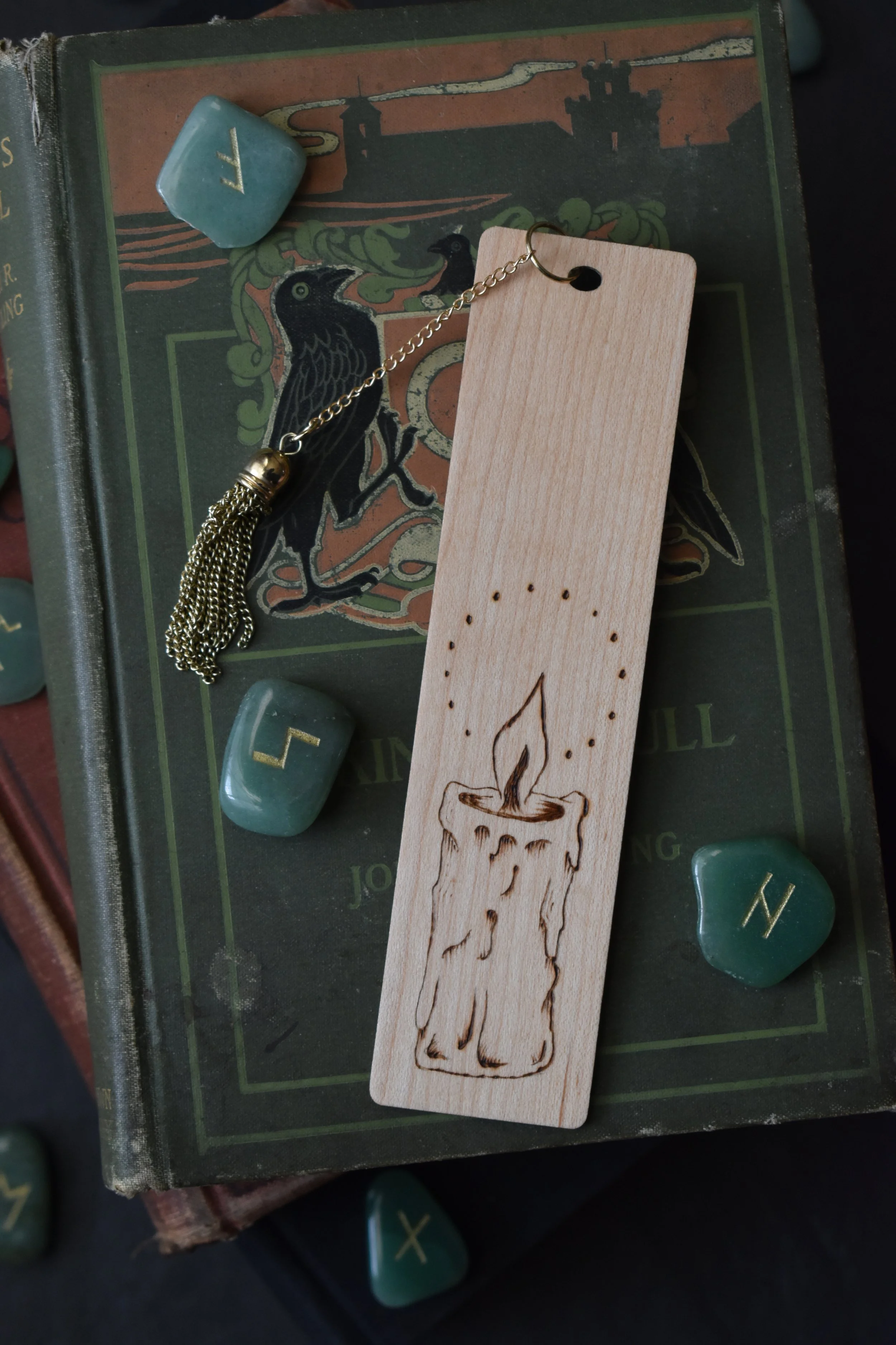Handmade wood-burned bookmark with detailed candle flame and smoke design, featuring vintage medieval-inspired artwork.