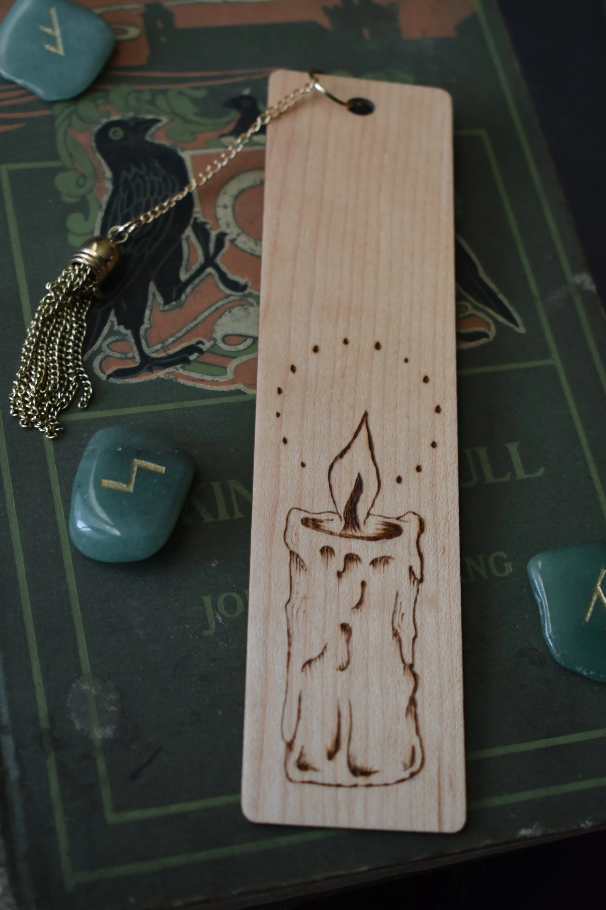 Handmade wood-burned bookmark with detailed candle flame and smoke design, featuring vintage medieval-inspired artwork.