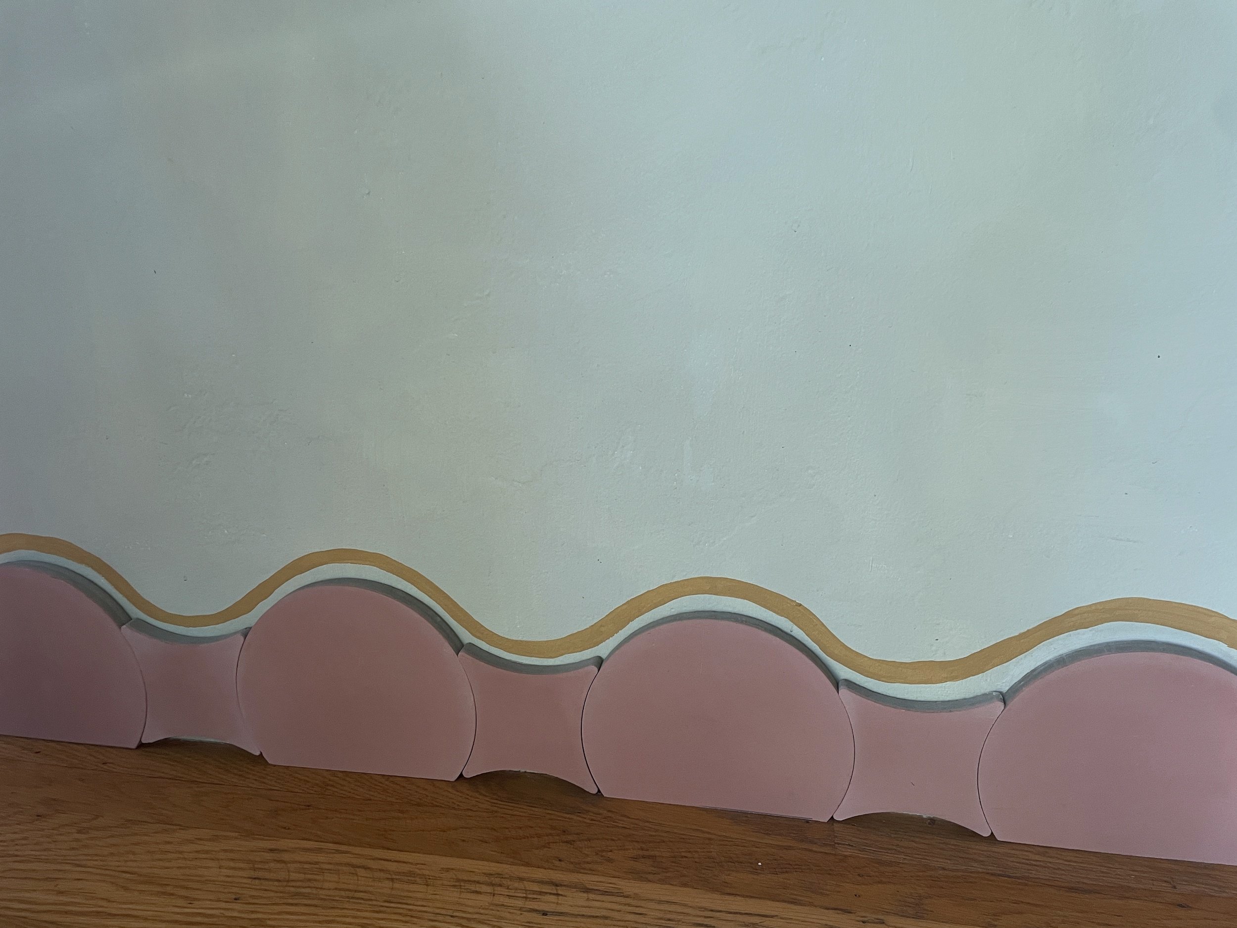 Baseboards are so boring! Tile and paint make a unique and joyful substitute.
