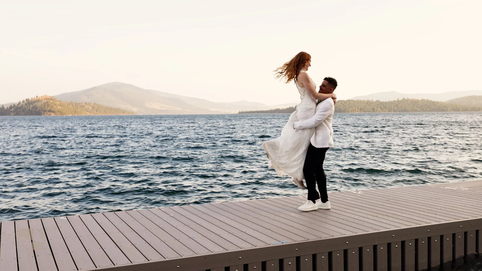 Jess and Matt celebrating on Flathead Lake during their Montana wedding