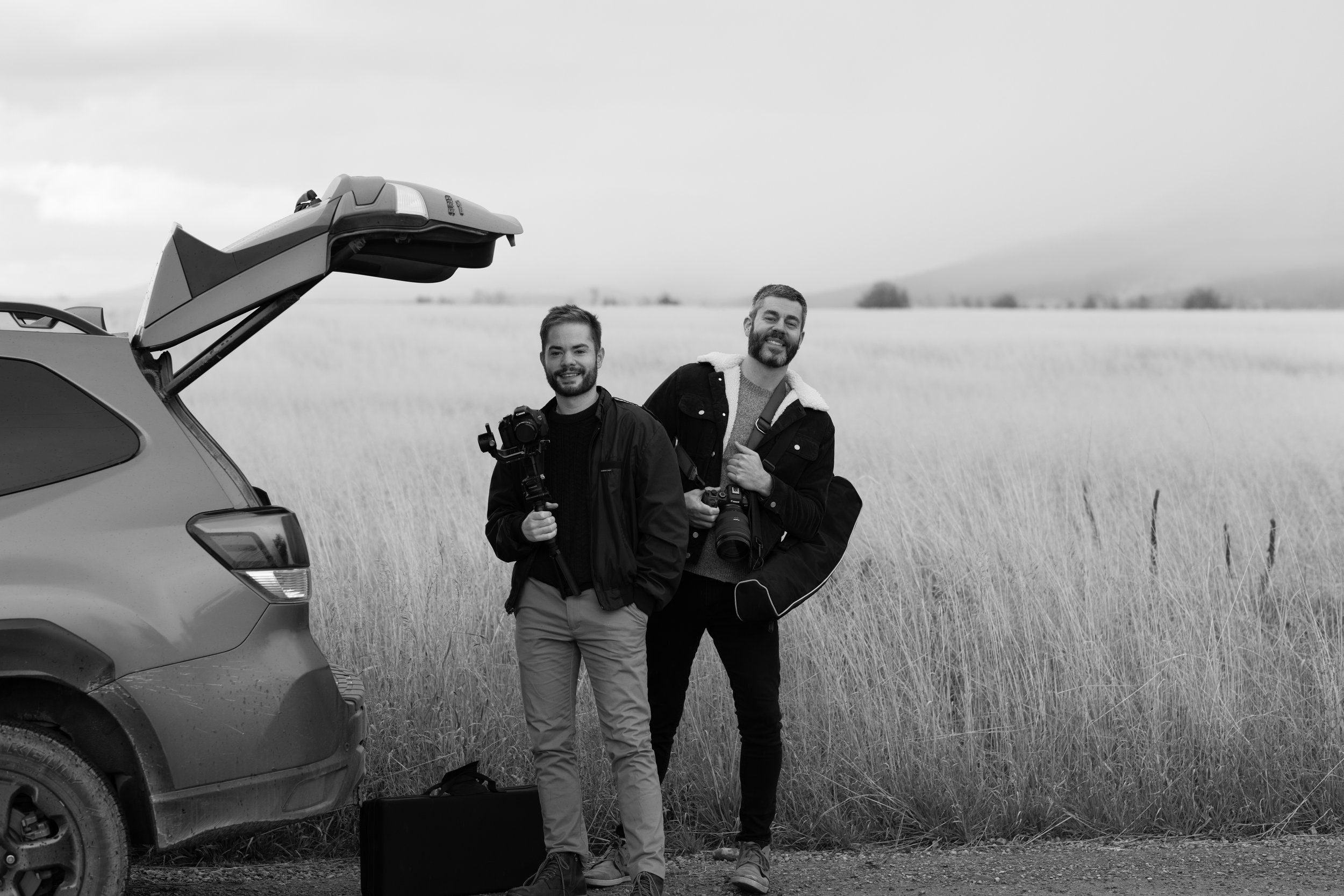Ryan & Kevin, of Prisma West, pose for a photo in the field.