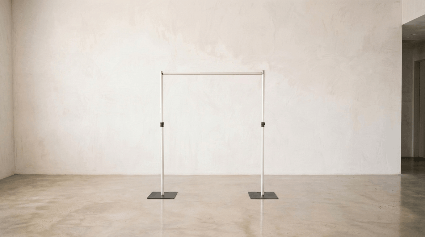 Professional 8x8ft heavy-duty backdrop stand for flower walls and event drapes, featuring stable base plates and a telescoping aluminum frame, field-tested for professional event reliability.