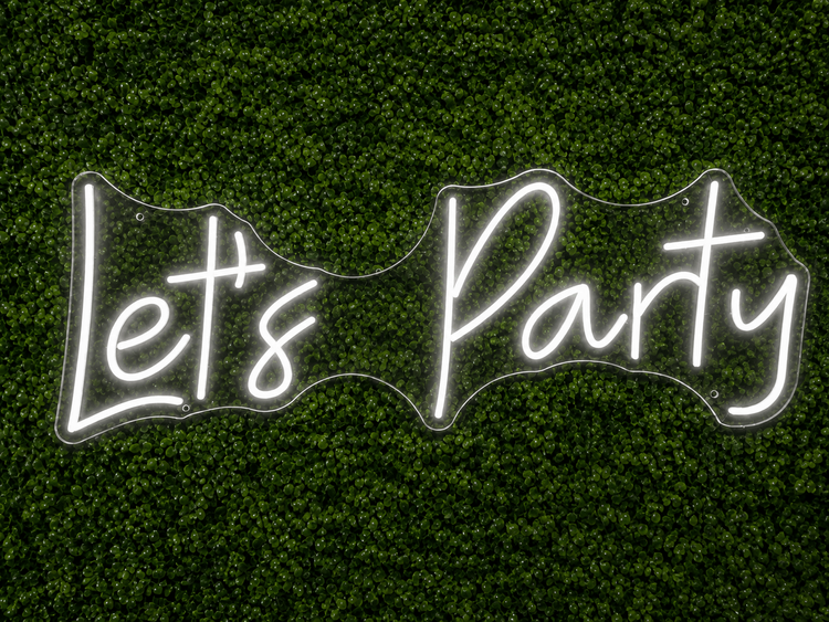 Let's Party white LED neon sign rental on clear acrylic displayed on a boxwood wall for Nashville events