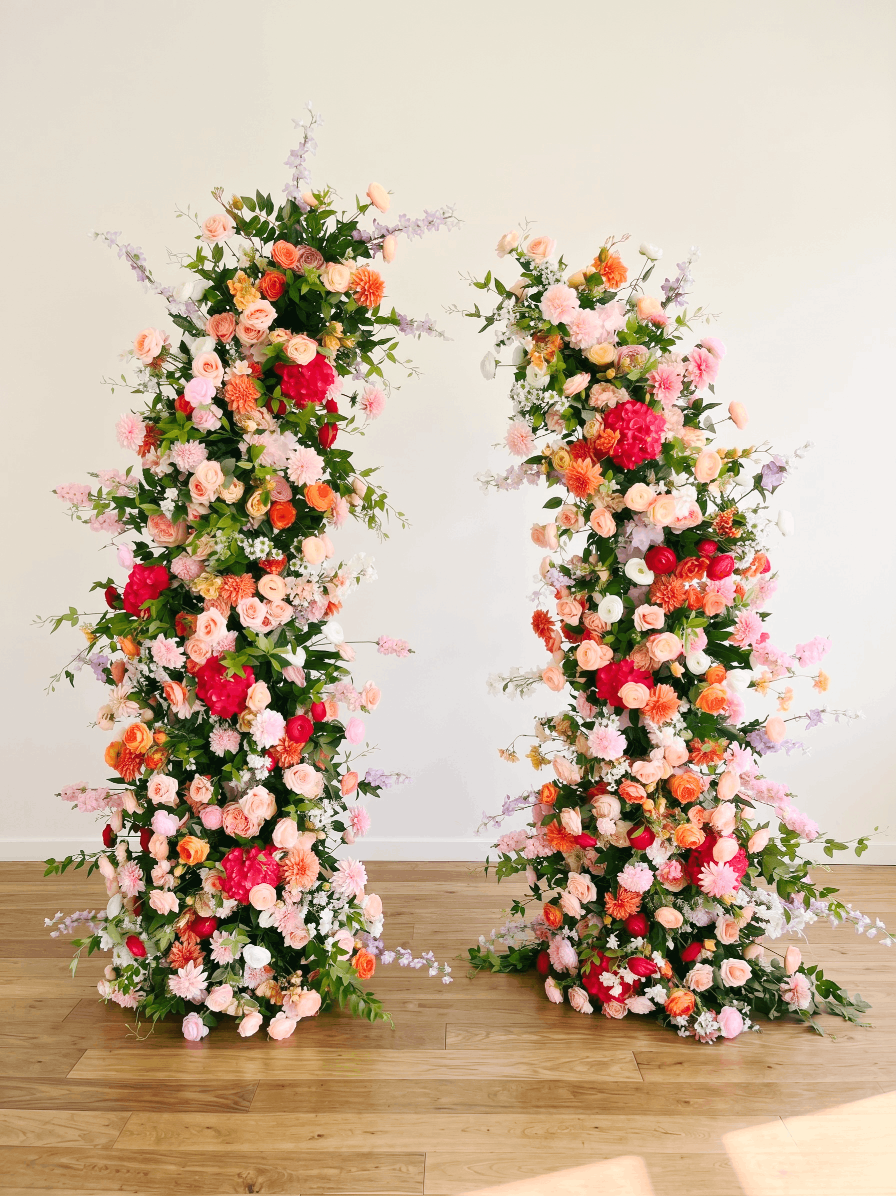 Colorful silk flower arch rental in Nashville with roses, peonies, and greenery – perfect for weddings, ceremonies, and luxury event backdrops.