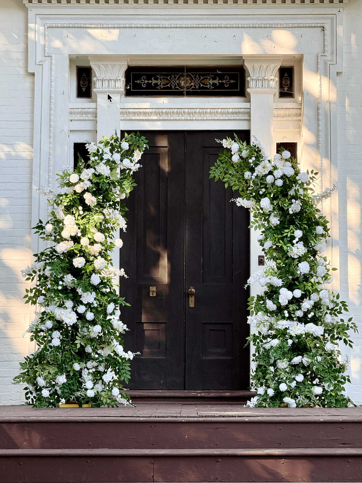 Olivia silk flower arch with greenery and white flowers at Riverwood Mansion wedding venue in Nashville
