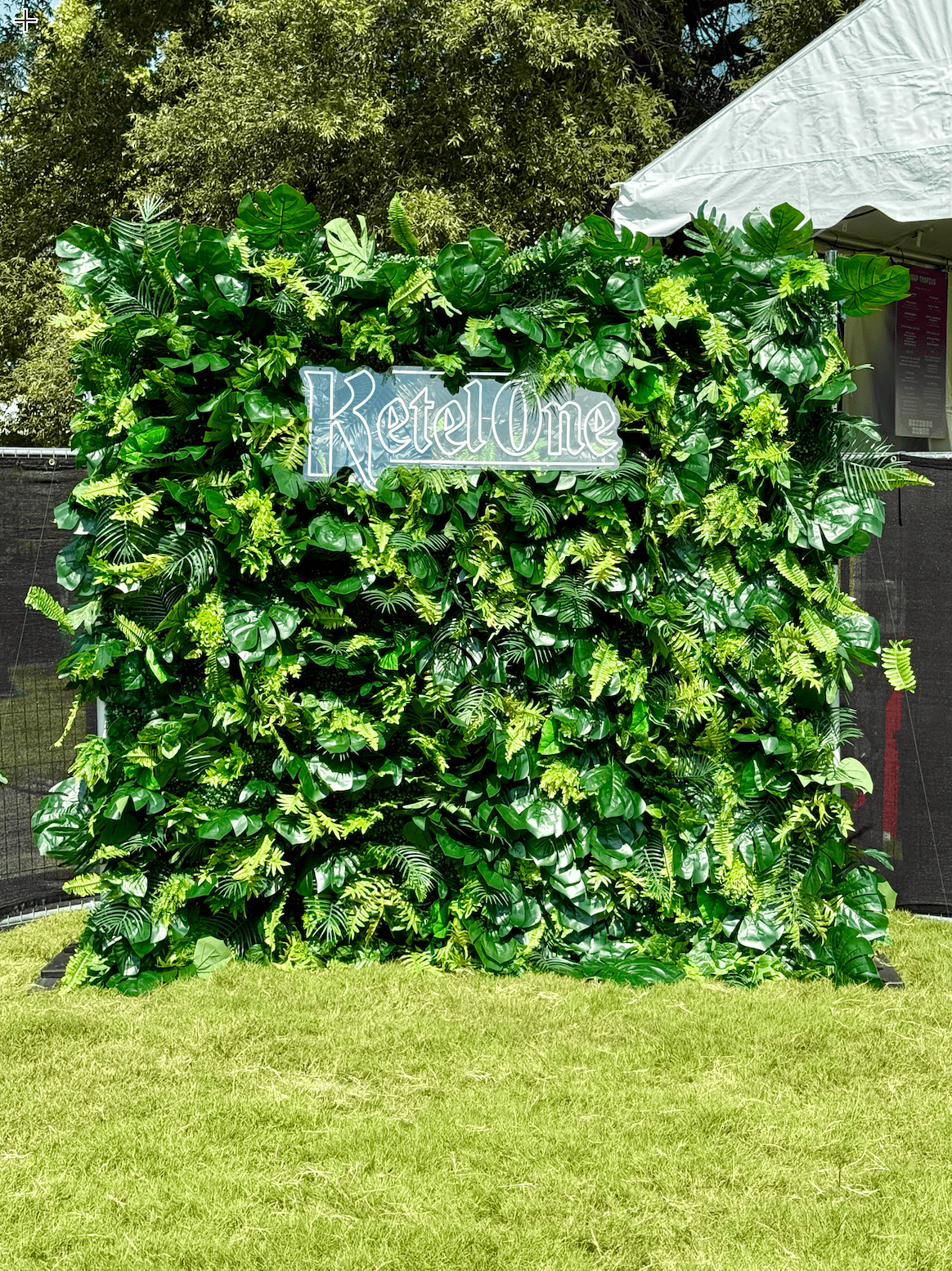 Lush tropical greenery wall backdrop available for corporate event rentals in Nashville. Perfect for brand activations, conferences, trade shows, and photo opportunities, this premium artificial plant wall adds a vibrant and professional touch to any