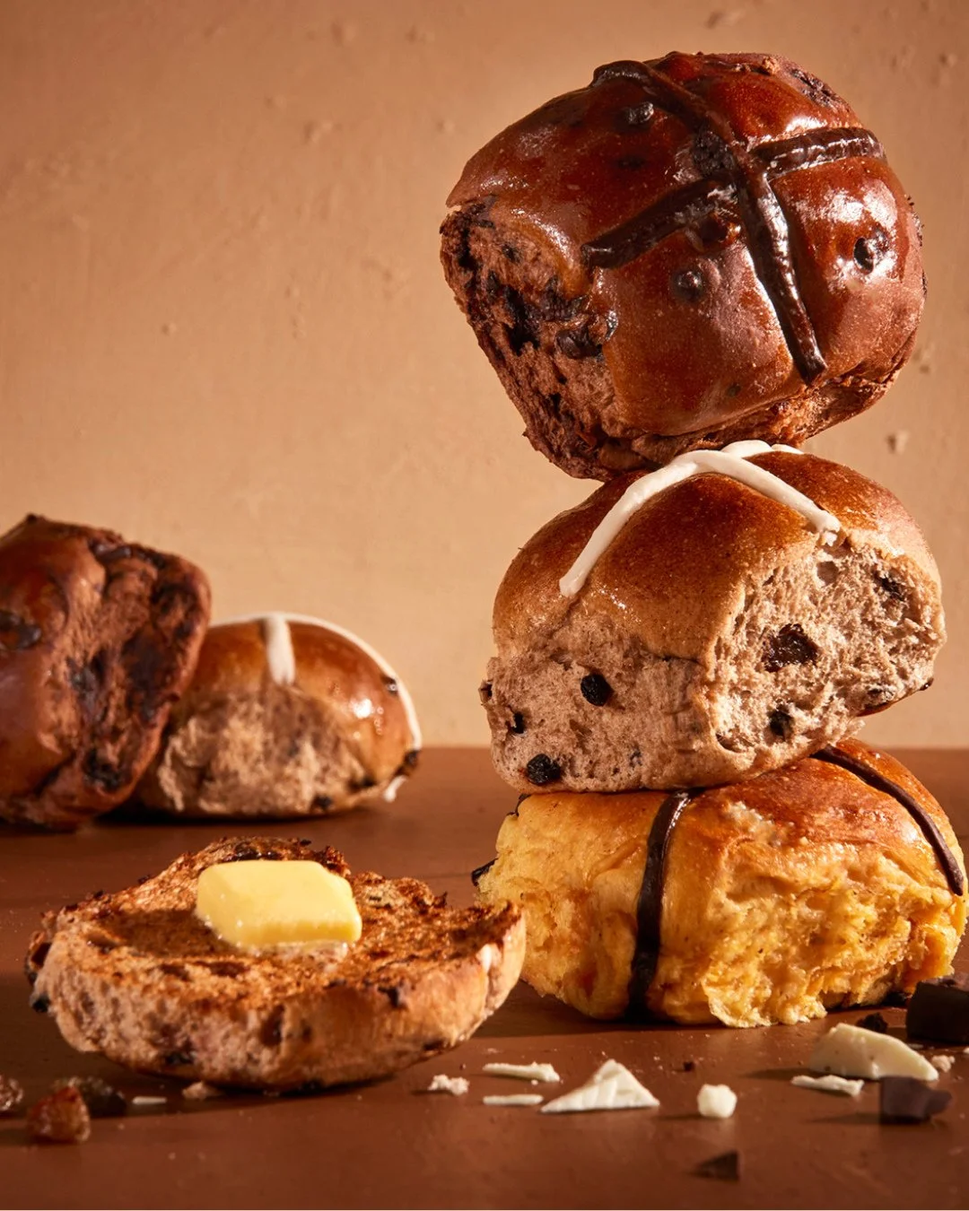 Now baking Traditional, Double Choc, Fruitless and our NEW Butterscotch, Fudge and White Choc Hot Cross Buns🤎