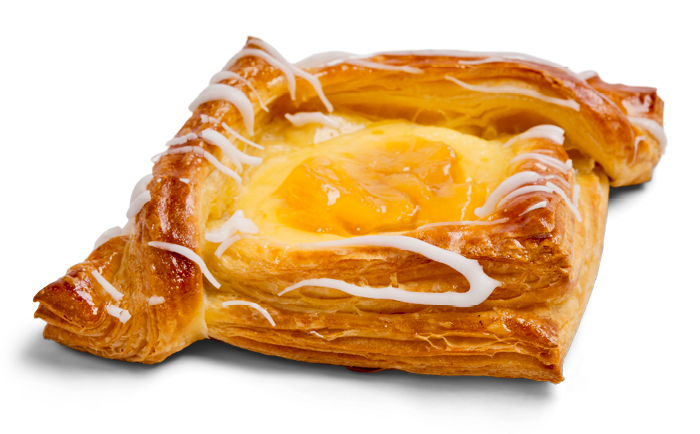 A Danish pastry with a flaky crust, filled with custard and topped with white icing drizzle.
