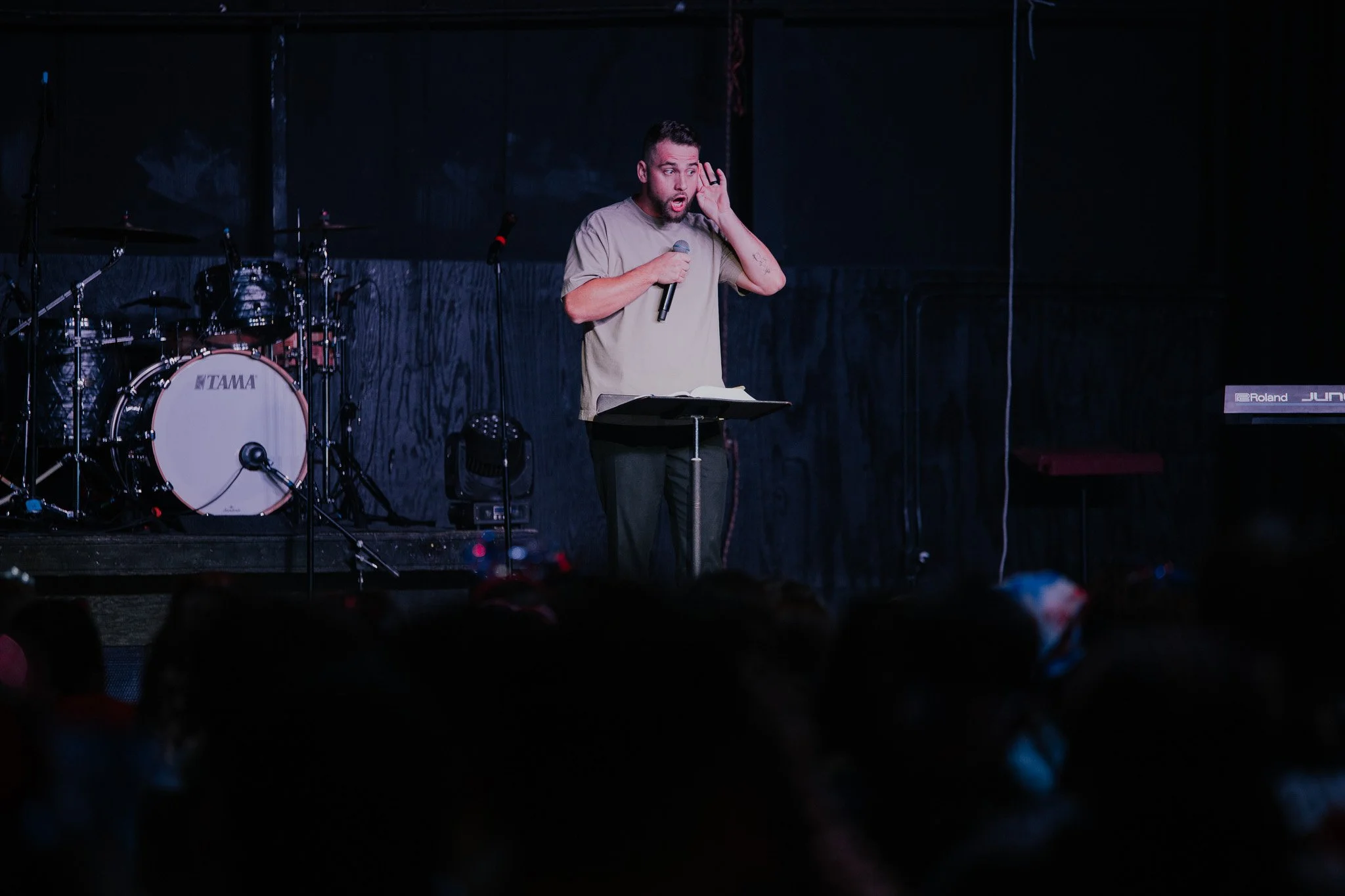 Lance Morris preaching with an open Bible