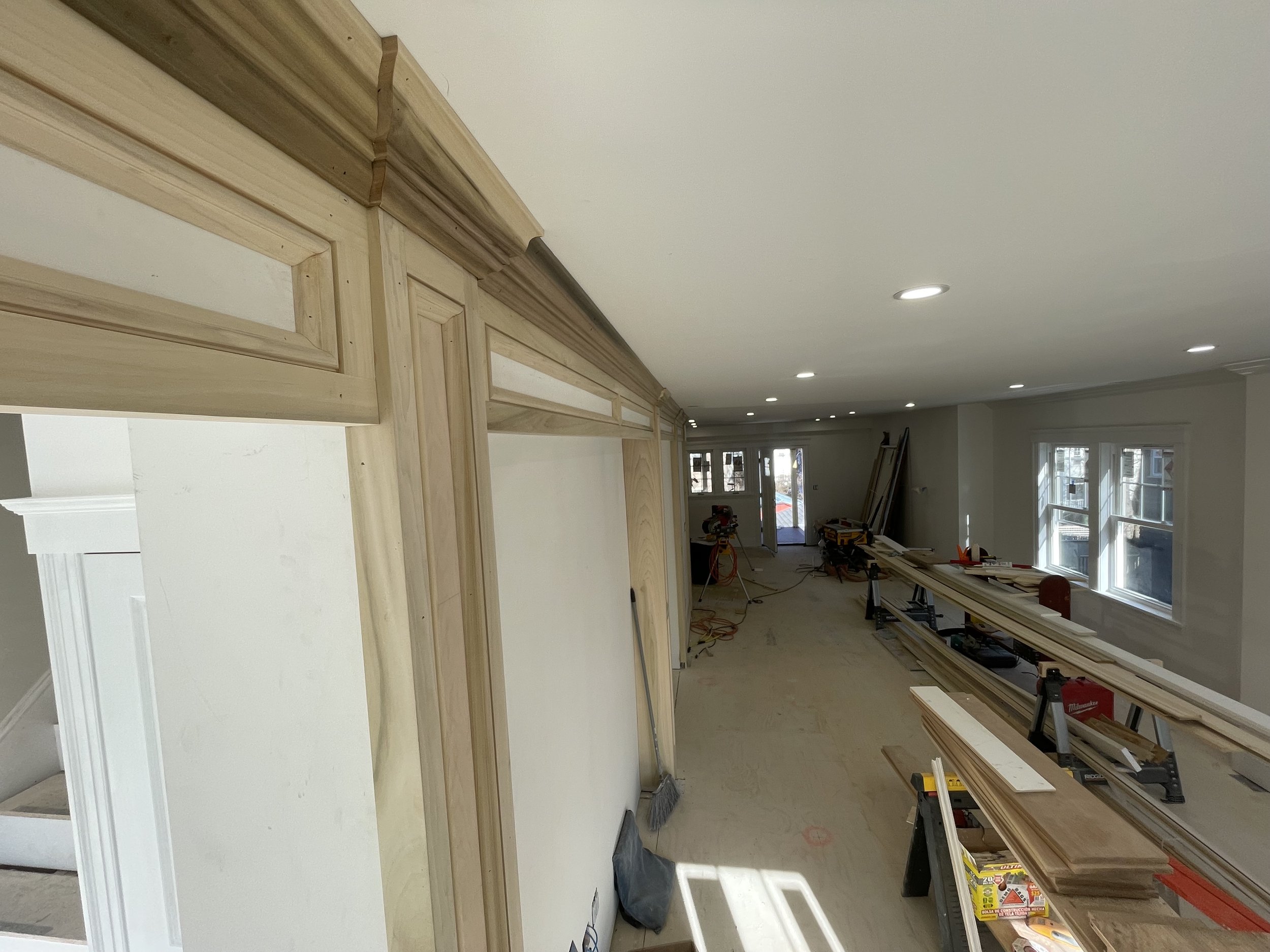 Instal windows and doors.  All trim details.  Stairs and Balustrade.  