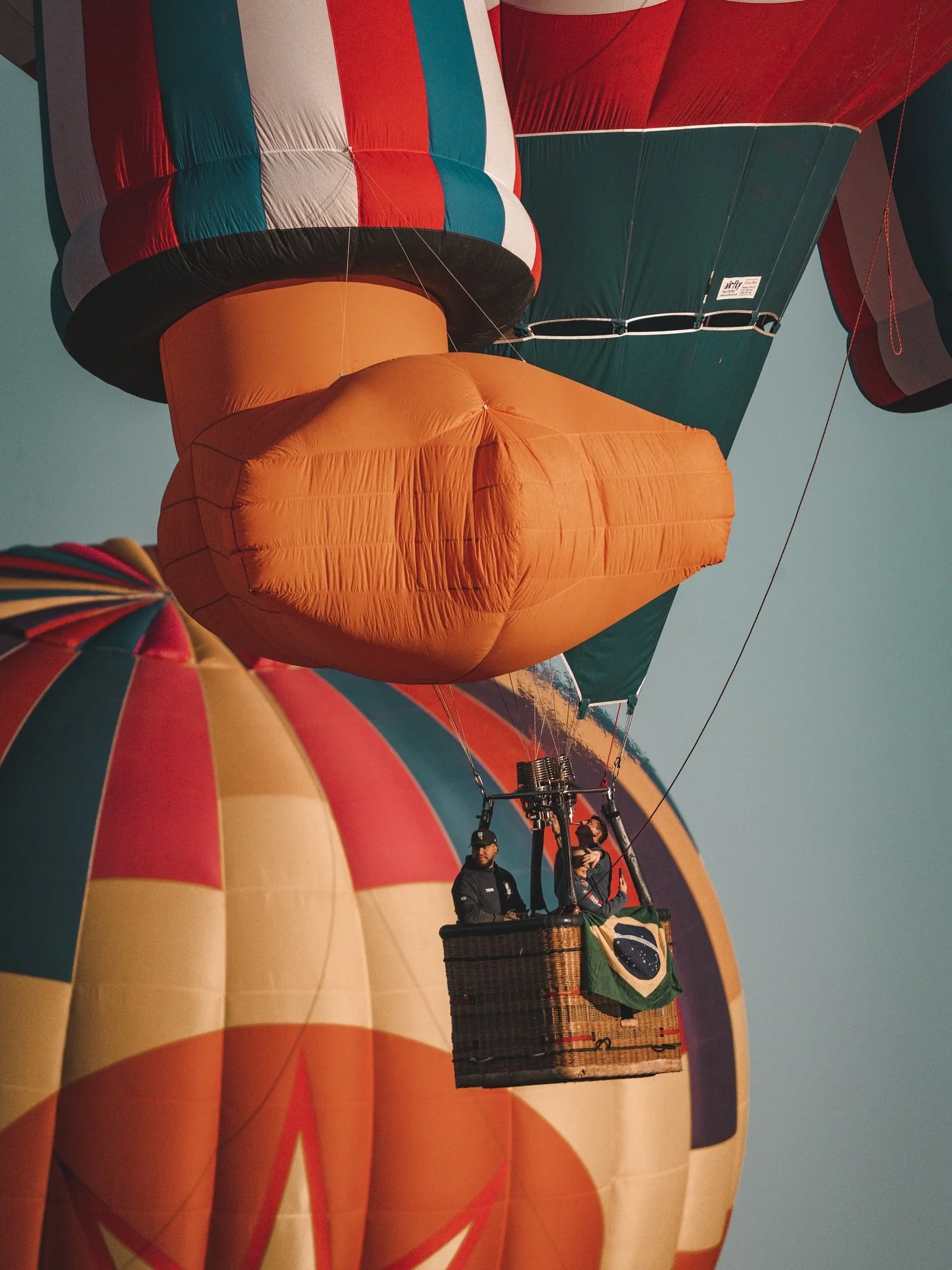 the vast size of these balloons is nearly unimaginable! here, @splashduckballoon is sailing away into the skies- you can only see his foot! @balloonfiesta really leaves you in awe and wonder ✨