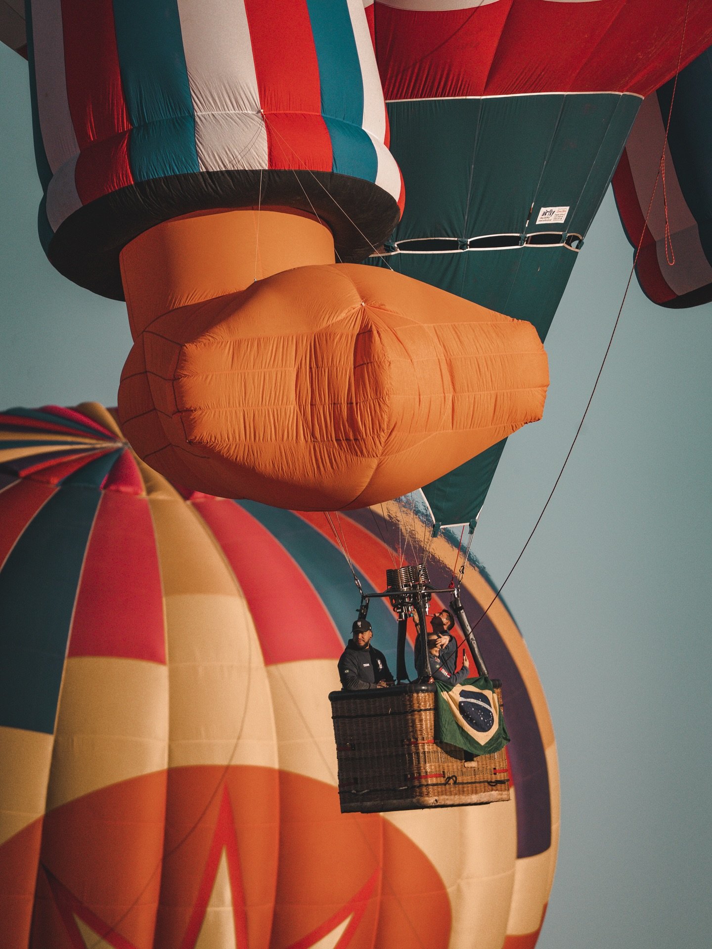 the vast size of these balloons is nearly unimaginable! here, @splashduckballoon is sailing away into the skies- you can only see his foot! @balloonfiesta really leaves you in awe and wonder ✨