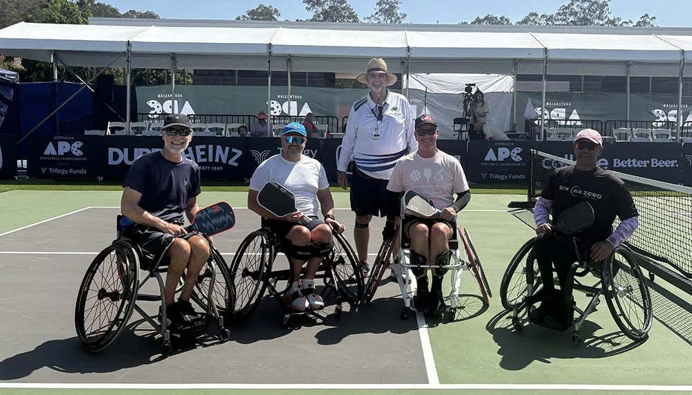 People playing wheelchair pickleball after spinal cord injury, demonstrating adaptive sport as part of rehabilitation and recovery.