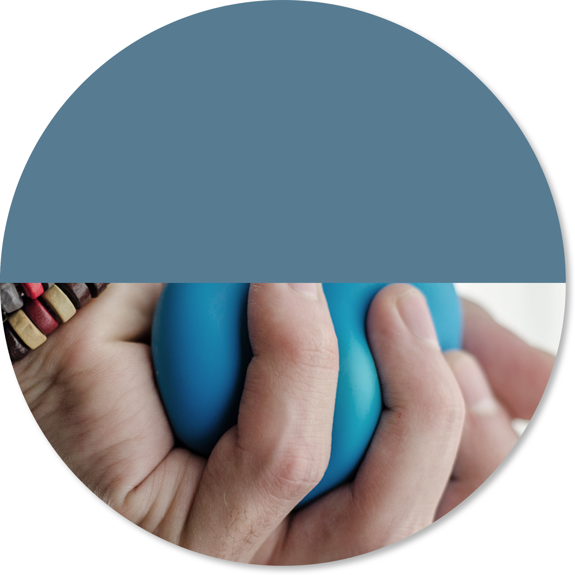 Close-up of a person squeezing a therapy ball during hand rehabilitation after stroke.