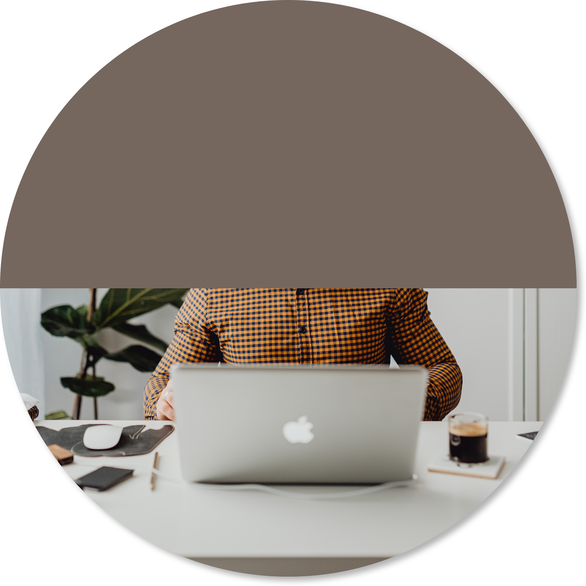Person working at a laptop in a calm office setting, representing improved planning, pacing, organisation, and sustainable work participation while managing fatigue or neurological challenges.