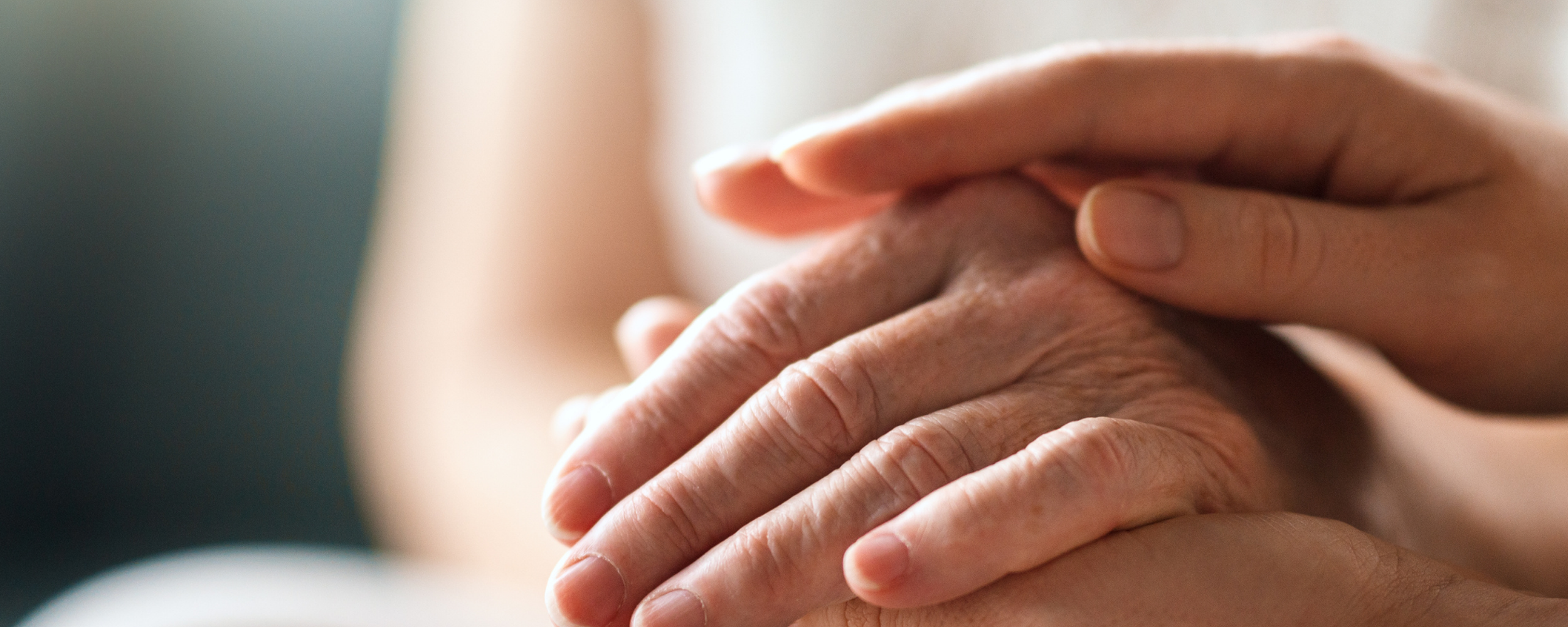 hand comforting person with Functional Neurological Disorder