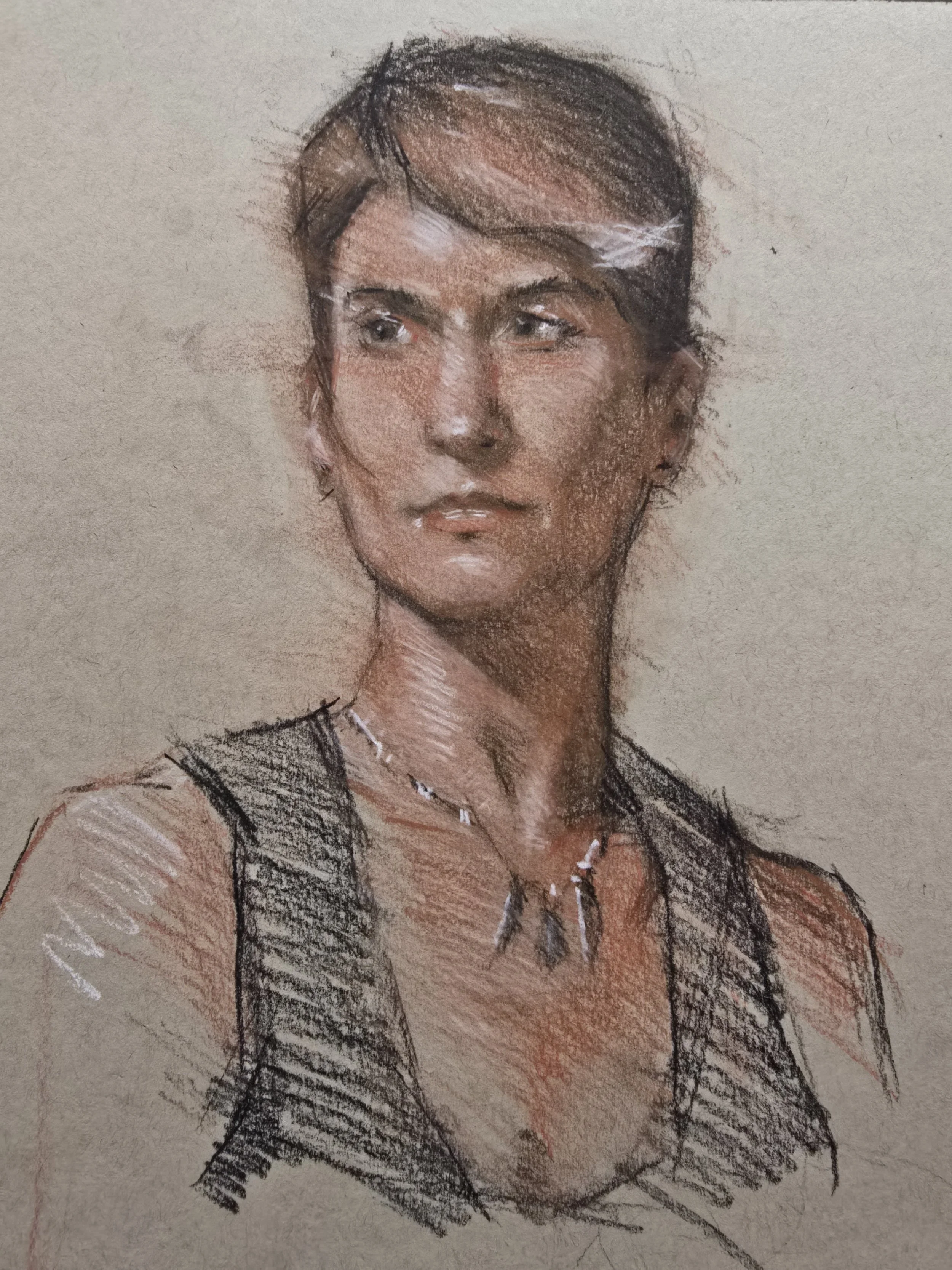 Student Work from Art Class. Colored pencil drawing of a woman with her hair pulled back, wearing a black sleeveless top and a silver necklace, looking to the side.