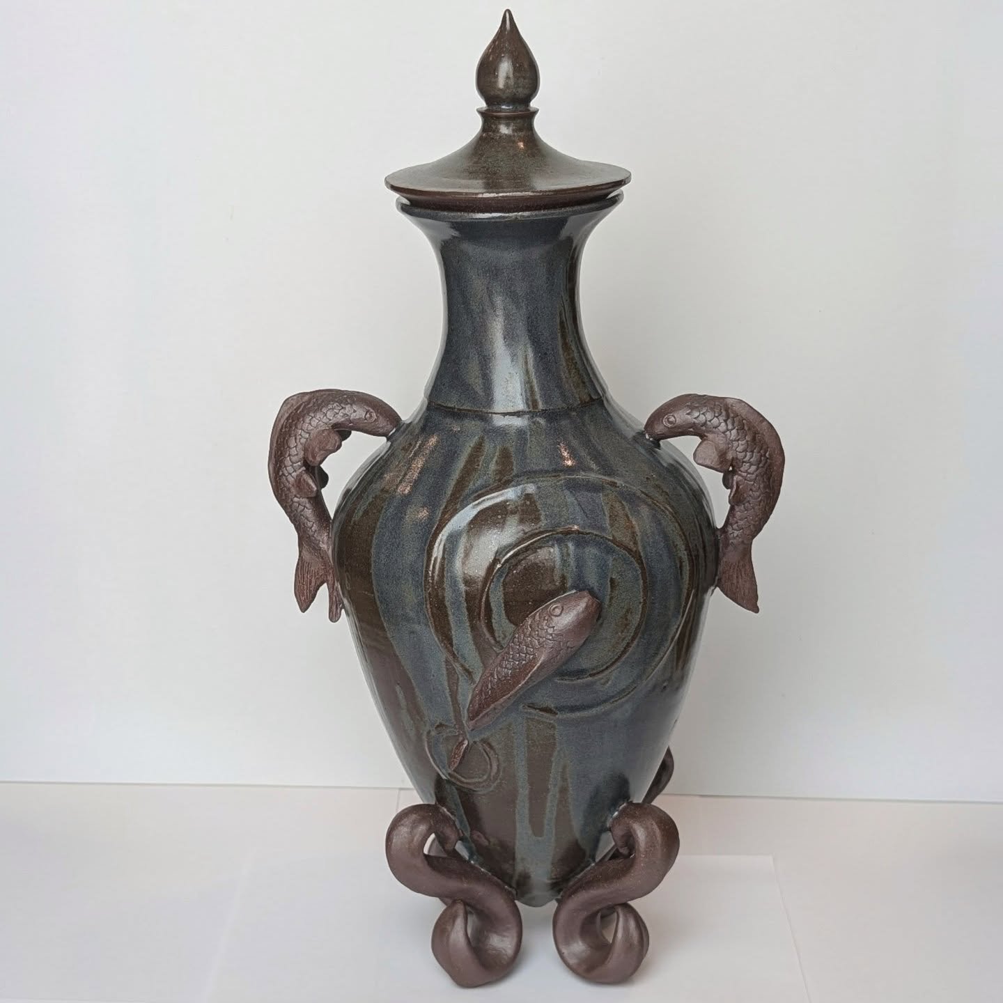 I realized I never shared the final results of these vessels from last fall. 

The fish vessel is kind of an amphora, an old vessel used to carry/store wine, often found in the Mediterranean region. For mine, I needed it to stand in the kiln and I wa