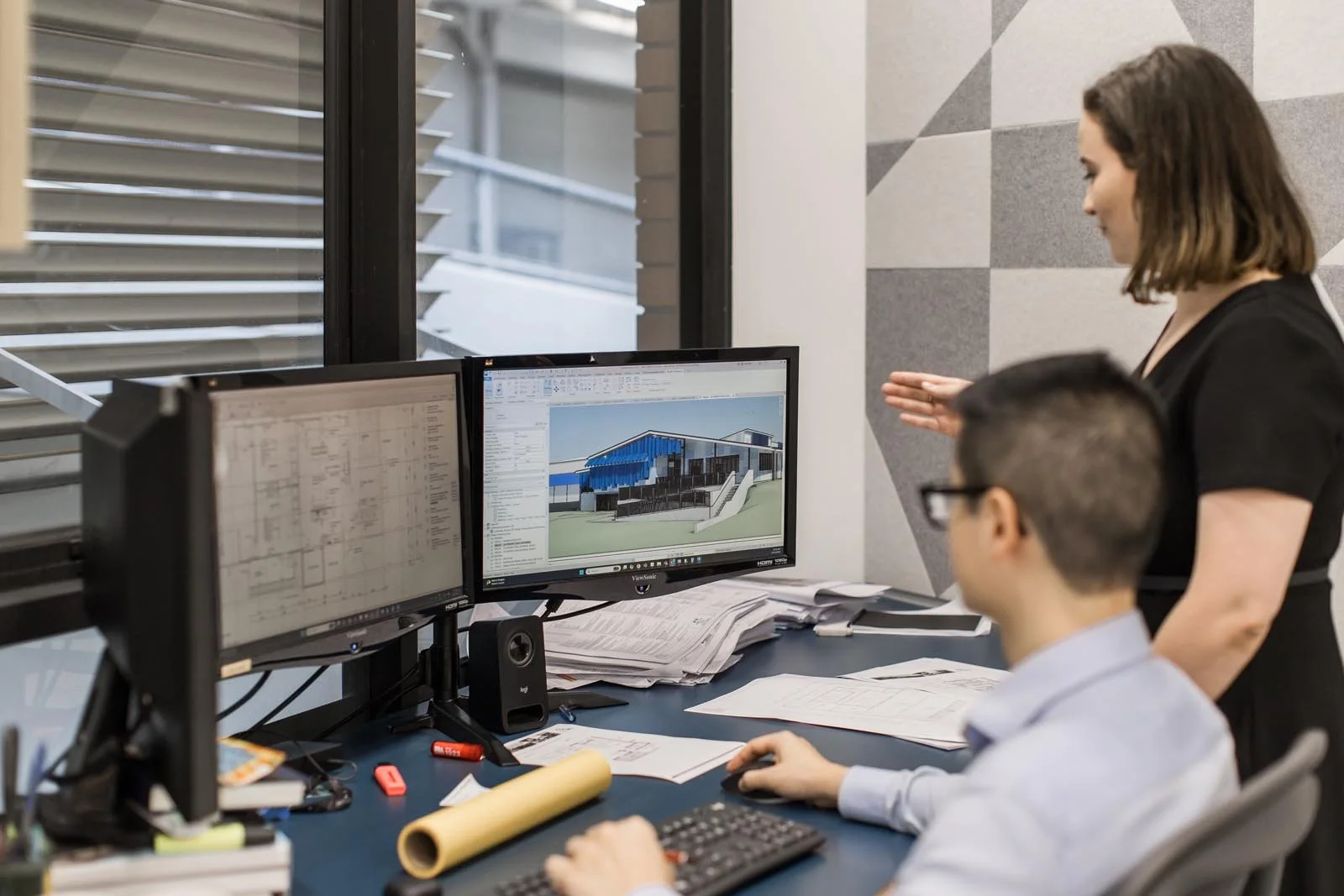 Brisbane architects working on a drawing