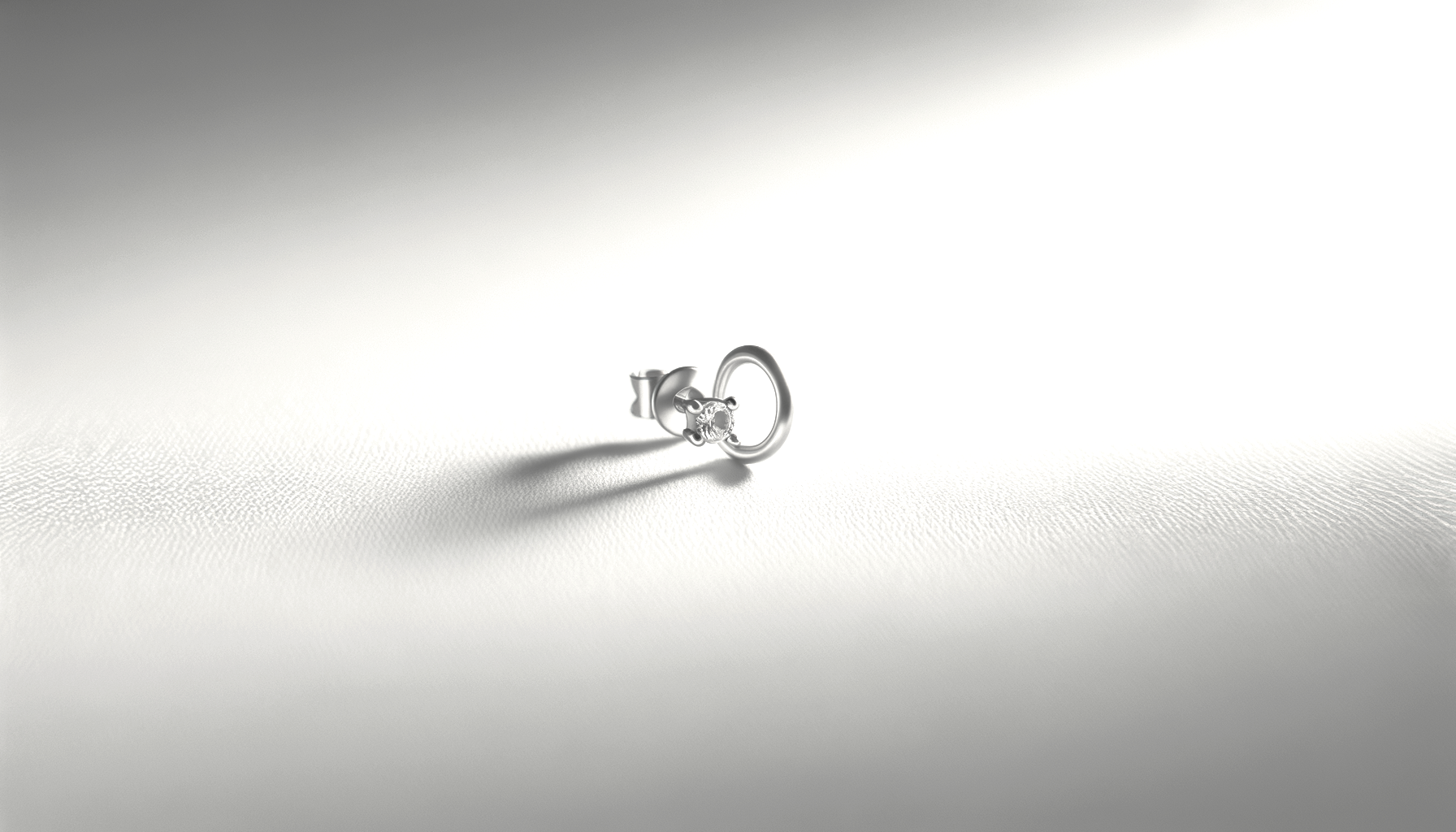 A diamond ring with a solitaire diamond in a setting, next to a silver key, placed on a textured white surface with a gradient background.