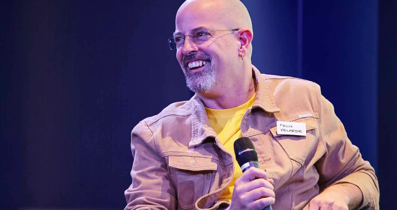 Felix Velarde, agency value proposition expert and workshop leader, author of Scale at Speed, speaking on stage in the UK or USA