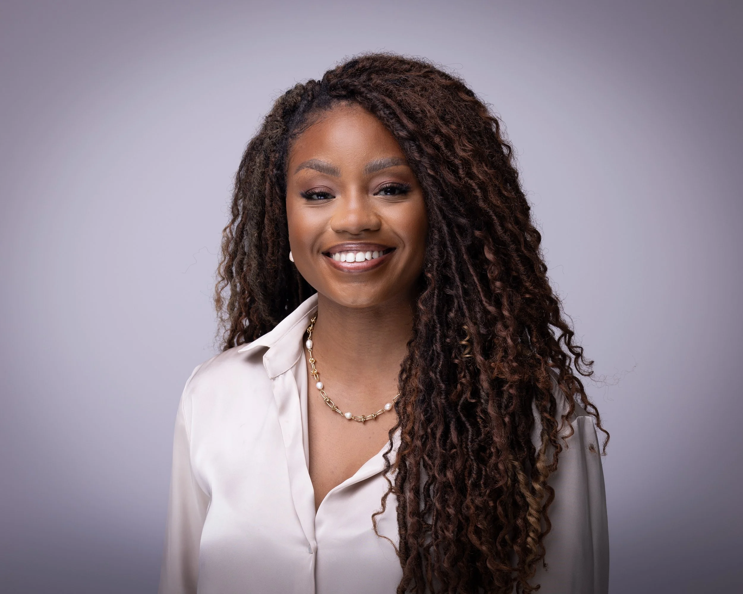 Corporate LinkedIn headshot taken on location in a modern London office with soft professional lighting.