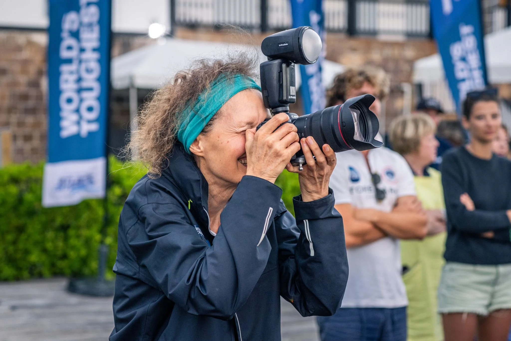 the photographer, a white female, London headshot photographer Penny Bird at work on location