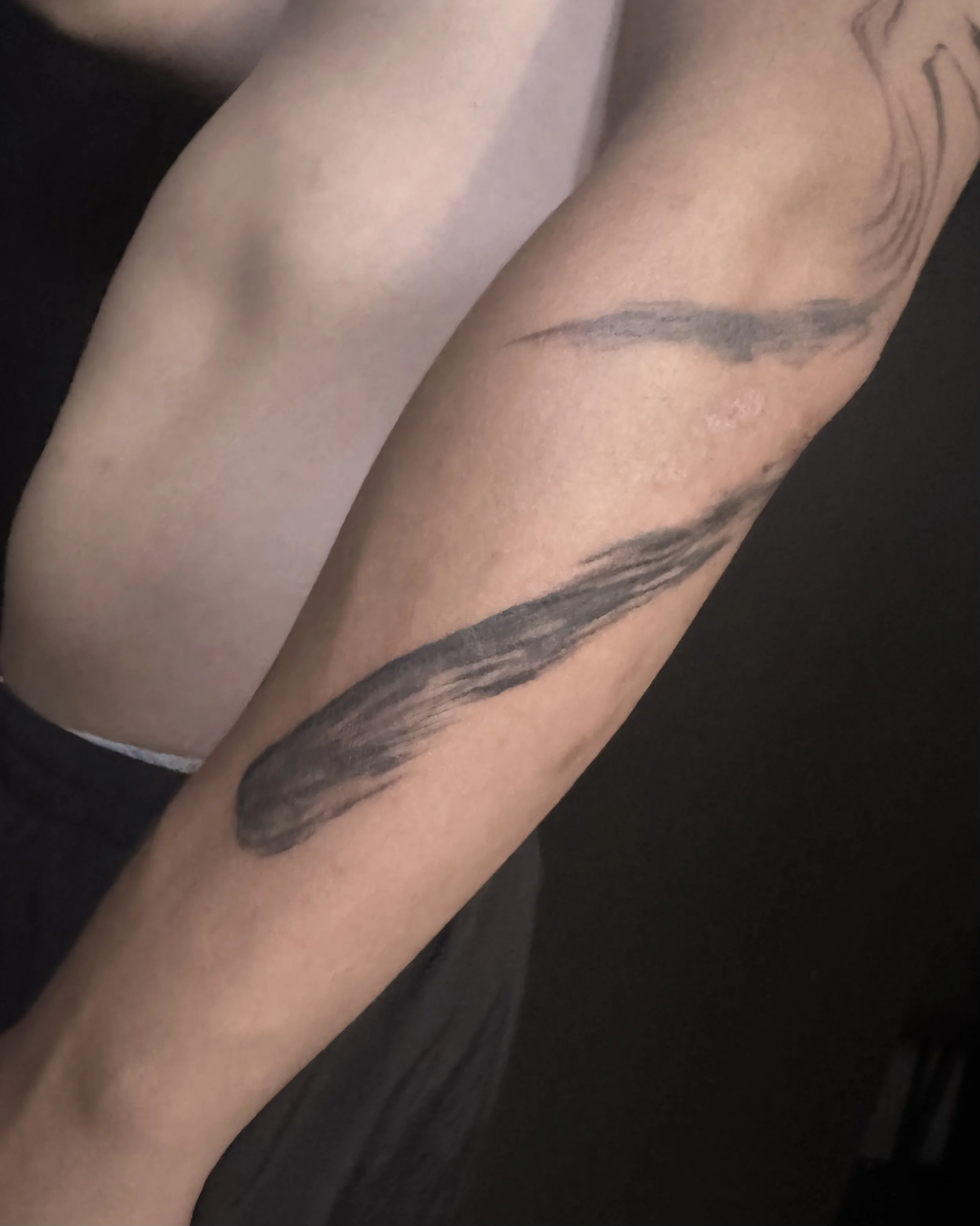 Close-up of Neo-Abstract Brushstrokes Tattoo Flow on forearm.