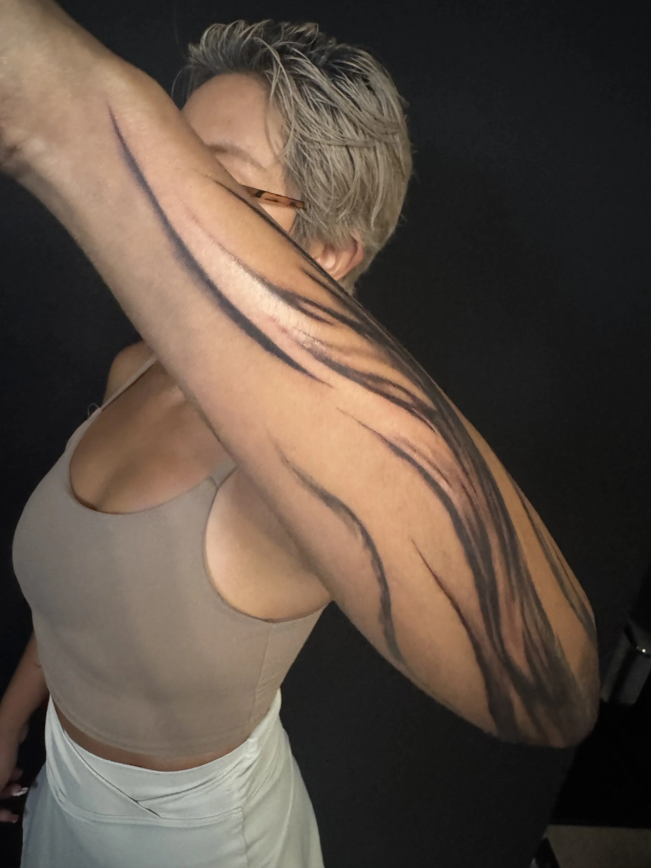 Close-up of Evolving Abstract Tattoo Flow on forearm.