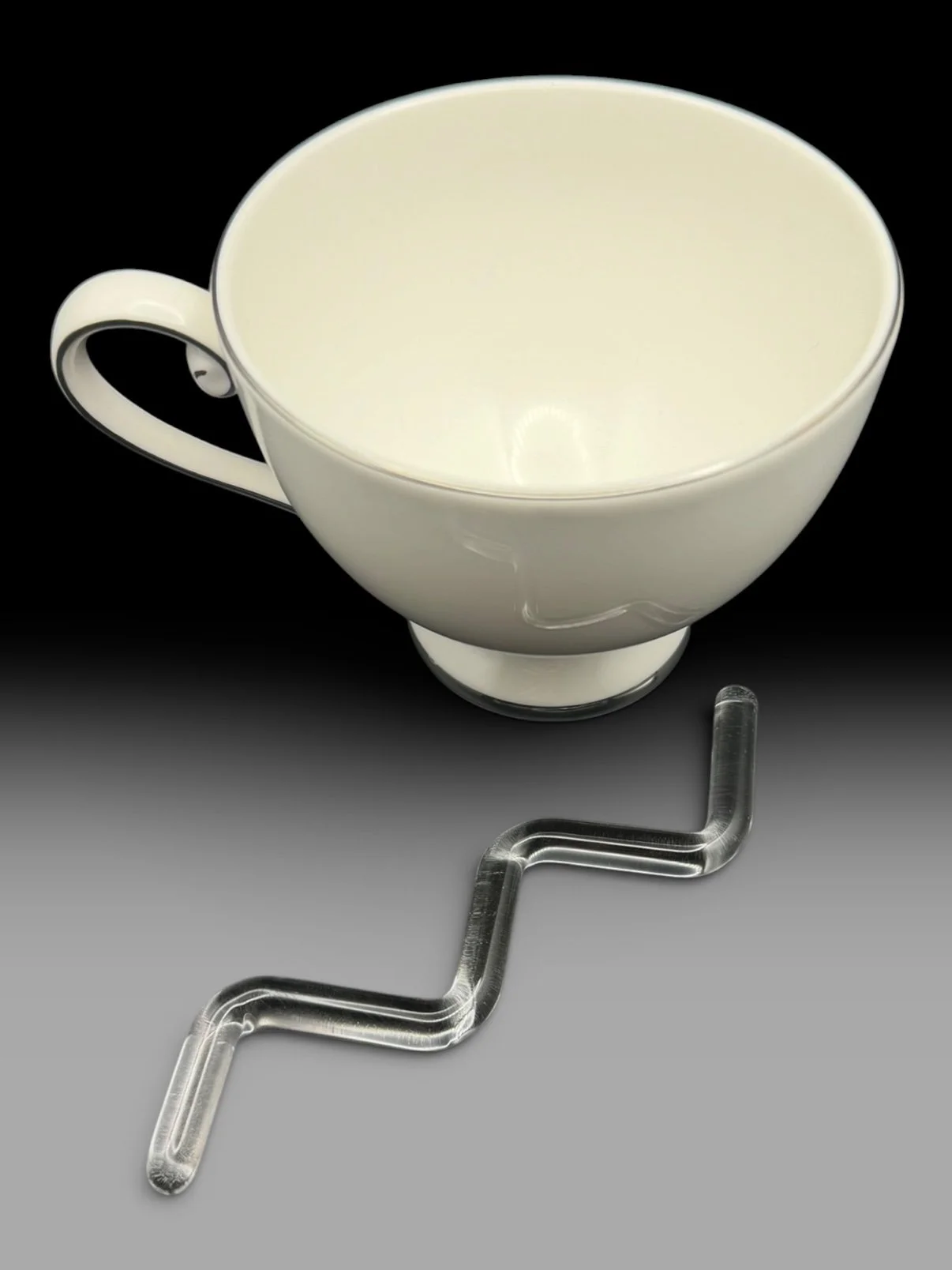 Glass stir beside a white coffee cup. Cup not included.