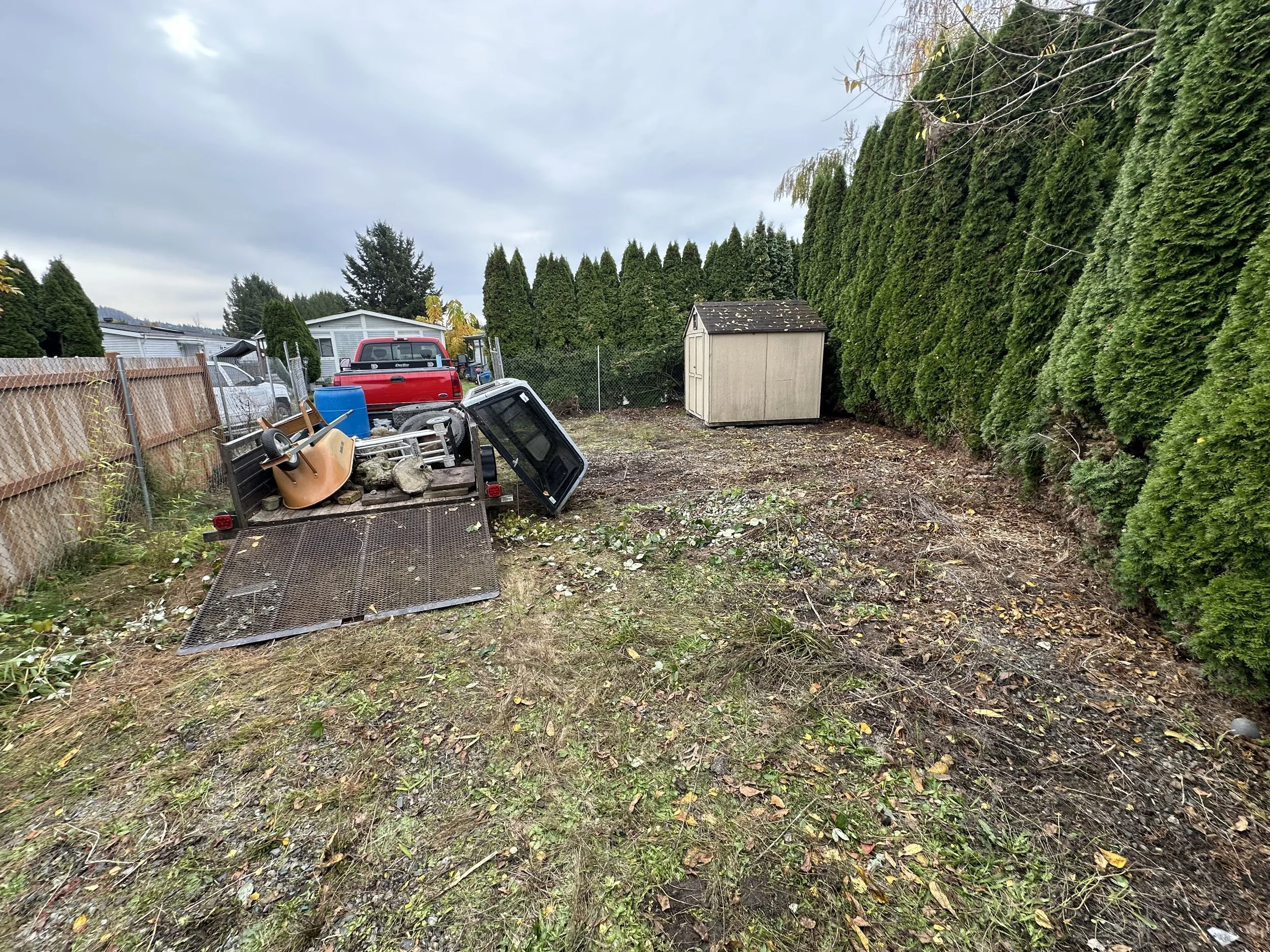 AFTER — Wide view of the cleared back lot following the final debris haul.