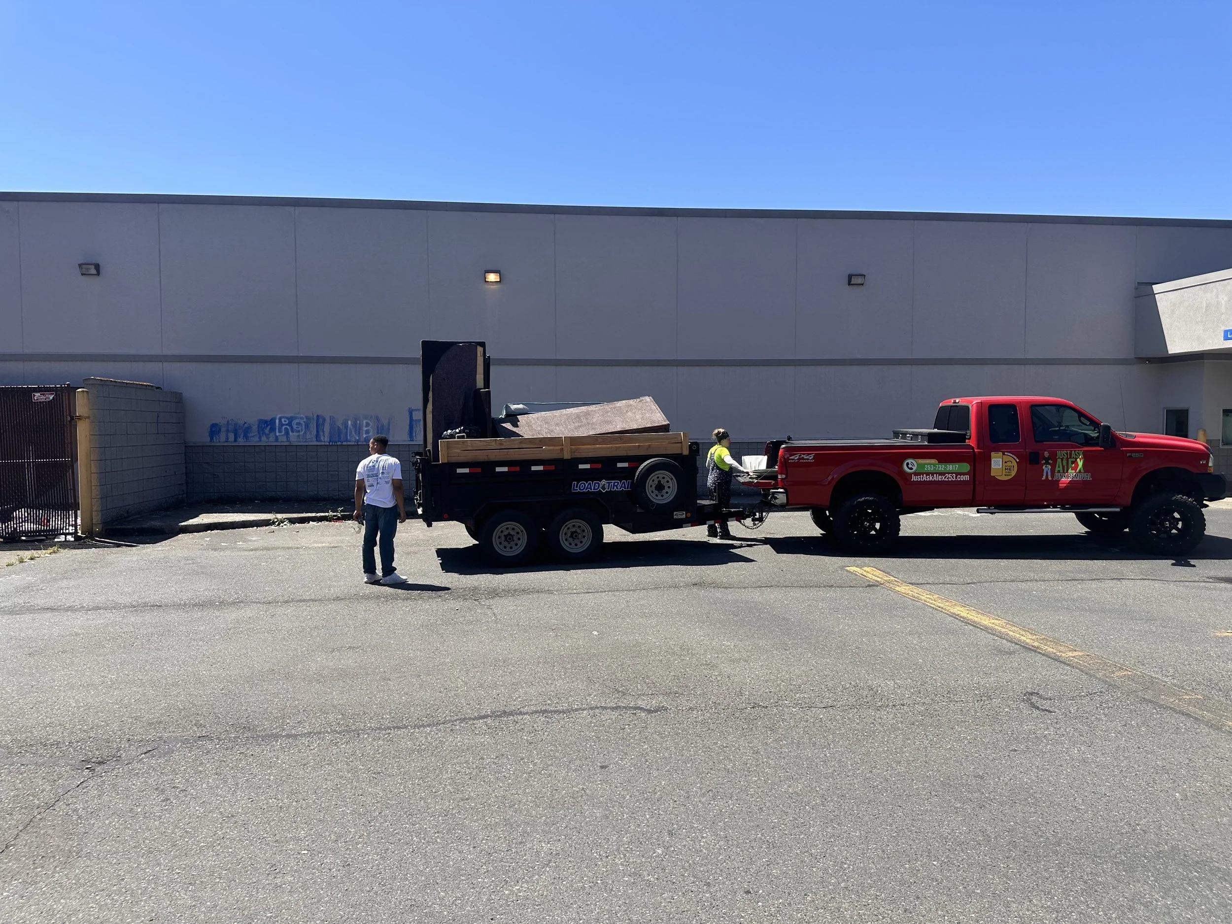 Just Ask Alex LLC truck and dump trailer at former Rite Aid property during commercial cleanup for SPS Property Group.