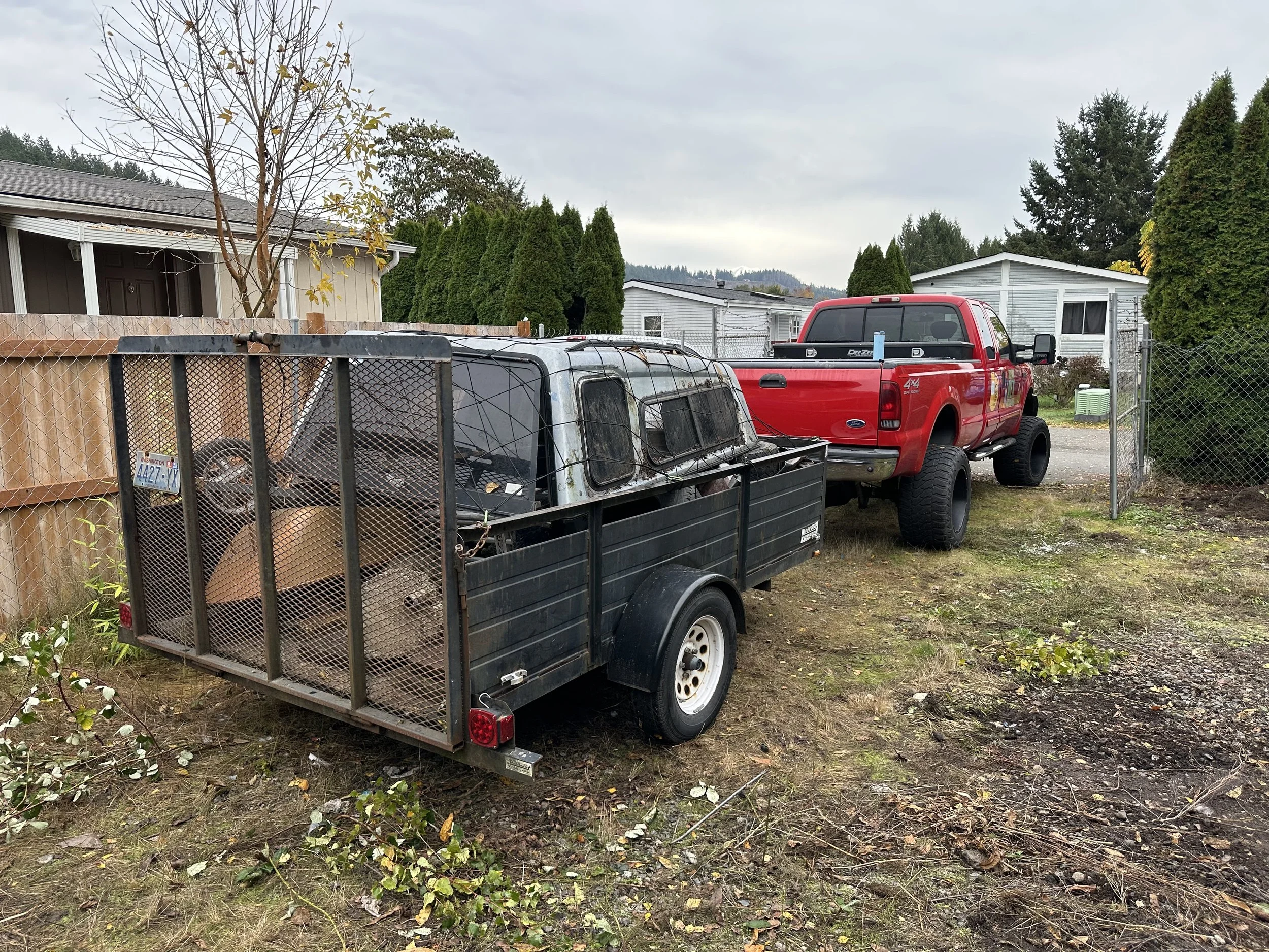 AFTER — Trailer loaded with the last items before the final dump run.