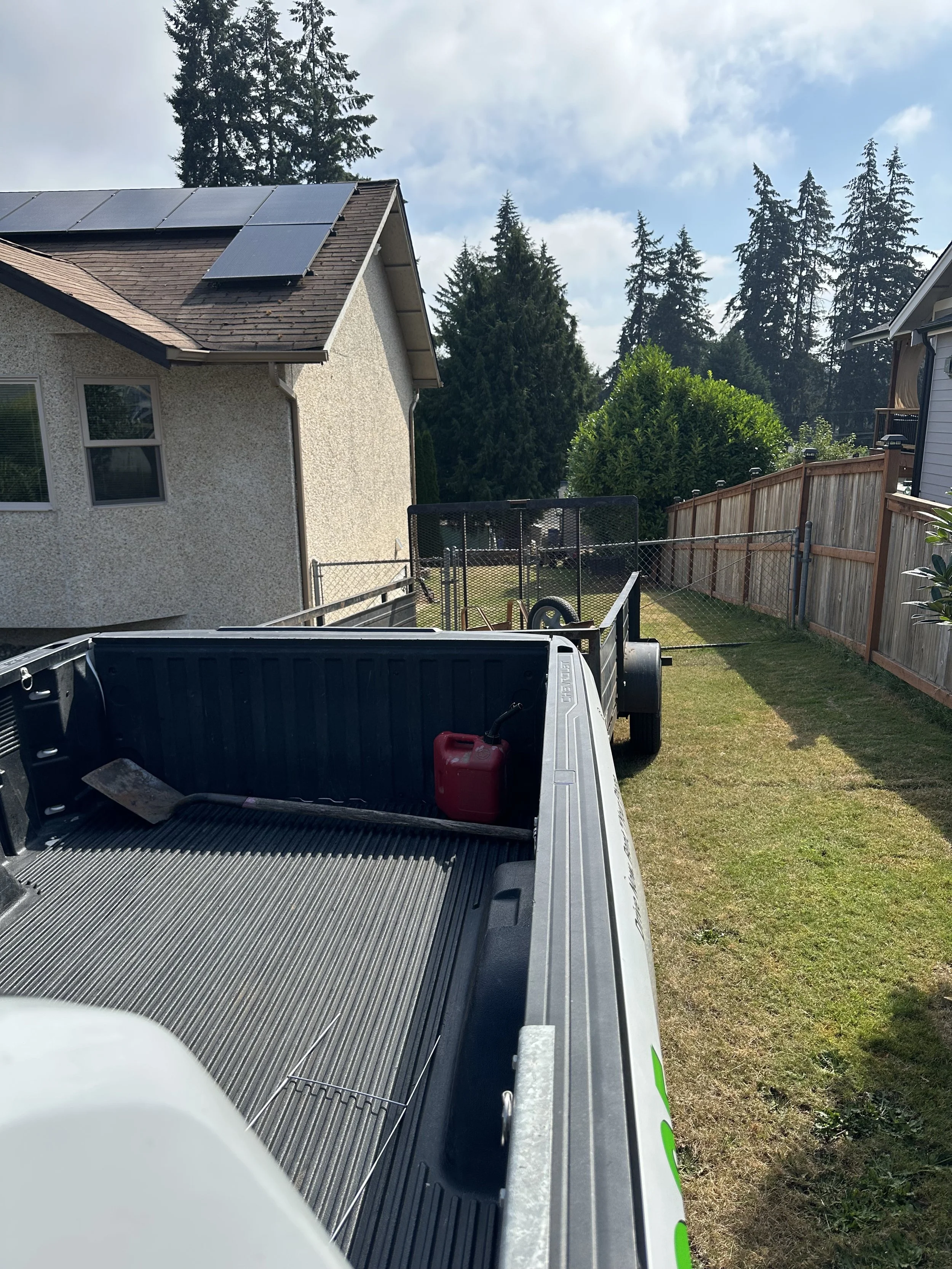 Loading — backed the trailer down the slope to load the heavy beam sections.