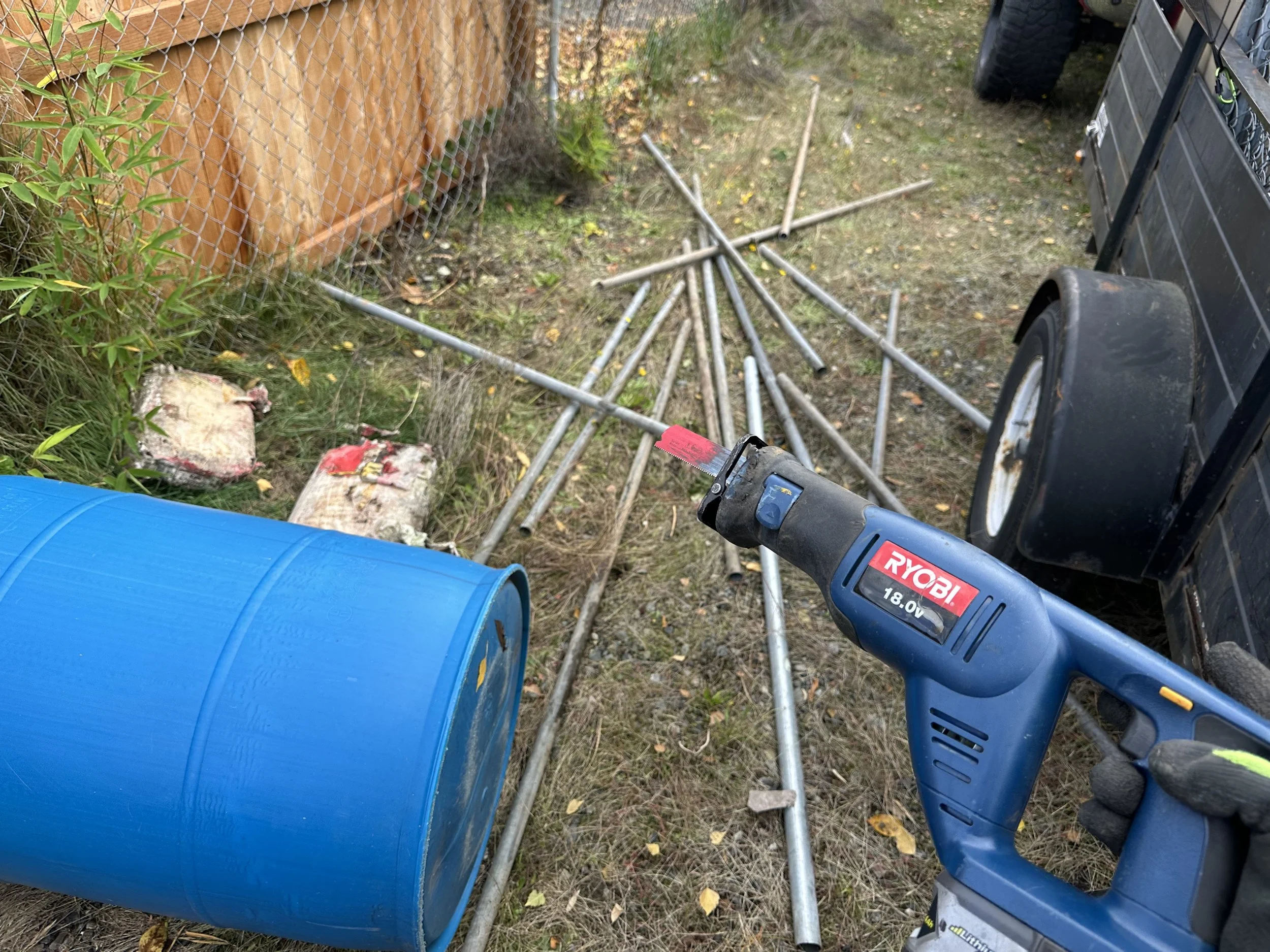DAY 3 — Cutting off metal fence posts from concrete, so metal can go to recycling and concrete can go to recycling.