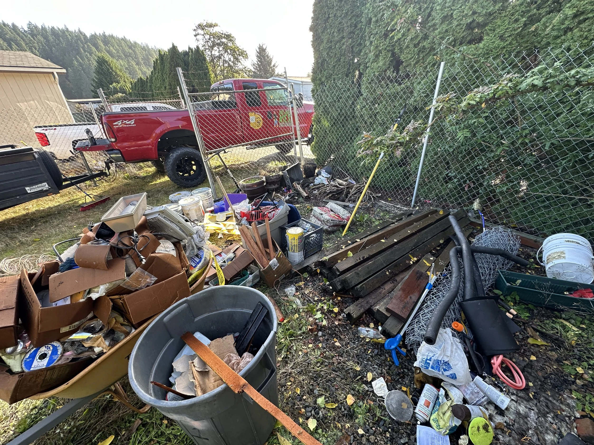DAY 3 — Clearing out the long fence-line pile that had built up over the years.