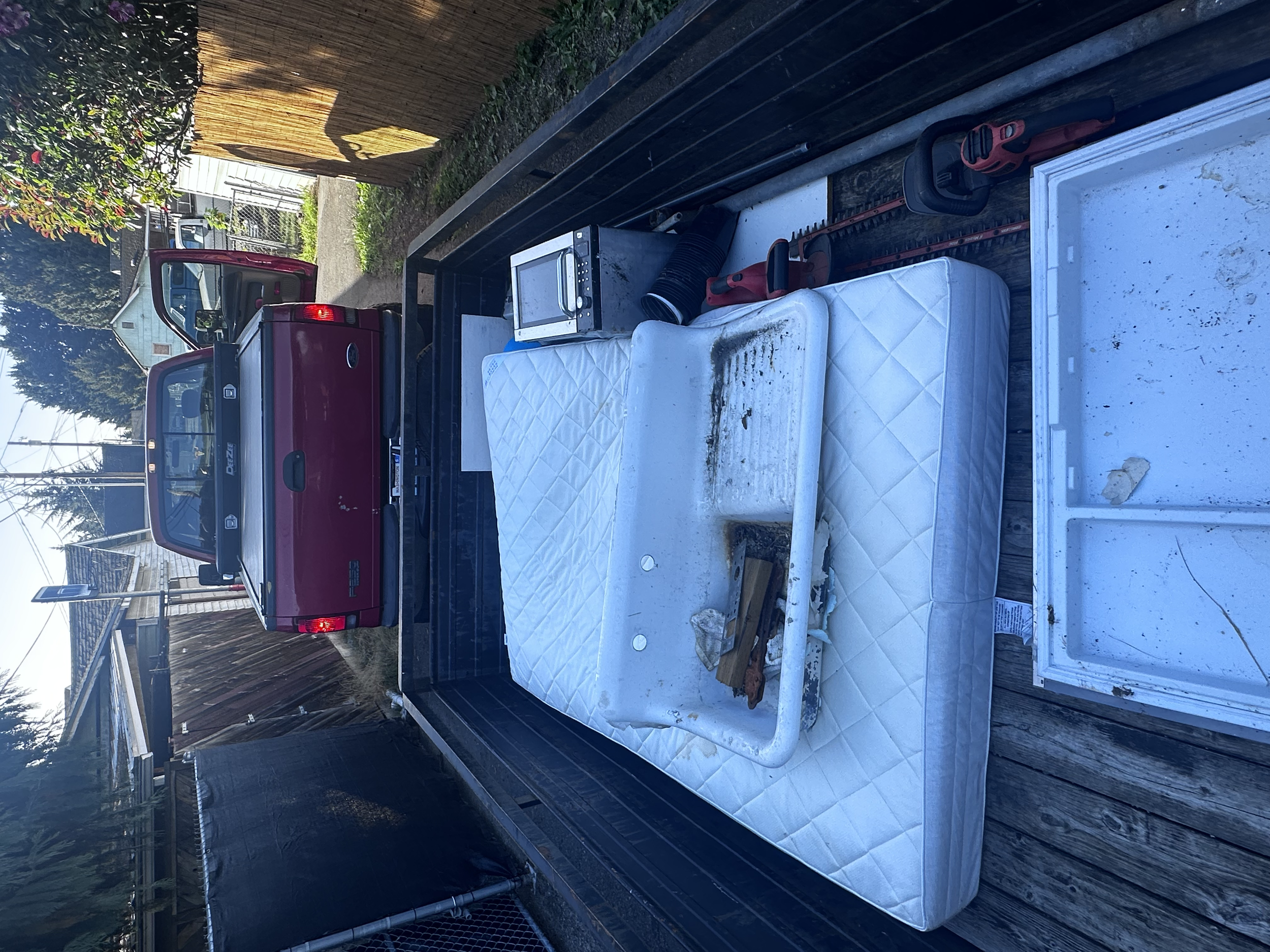Mixed construction and household junk before offload at dump – Auburn WA