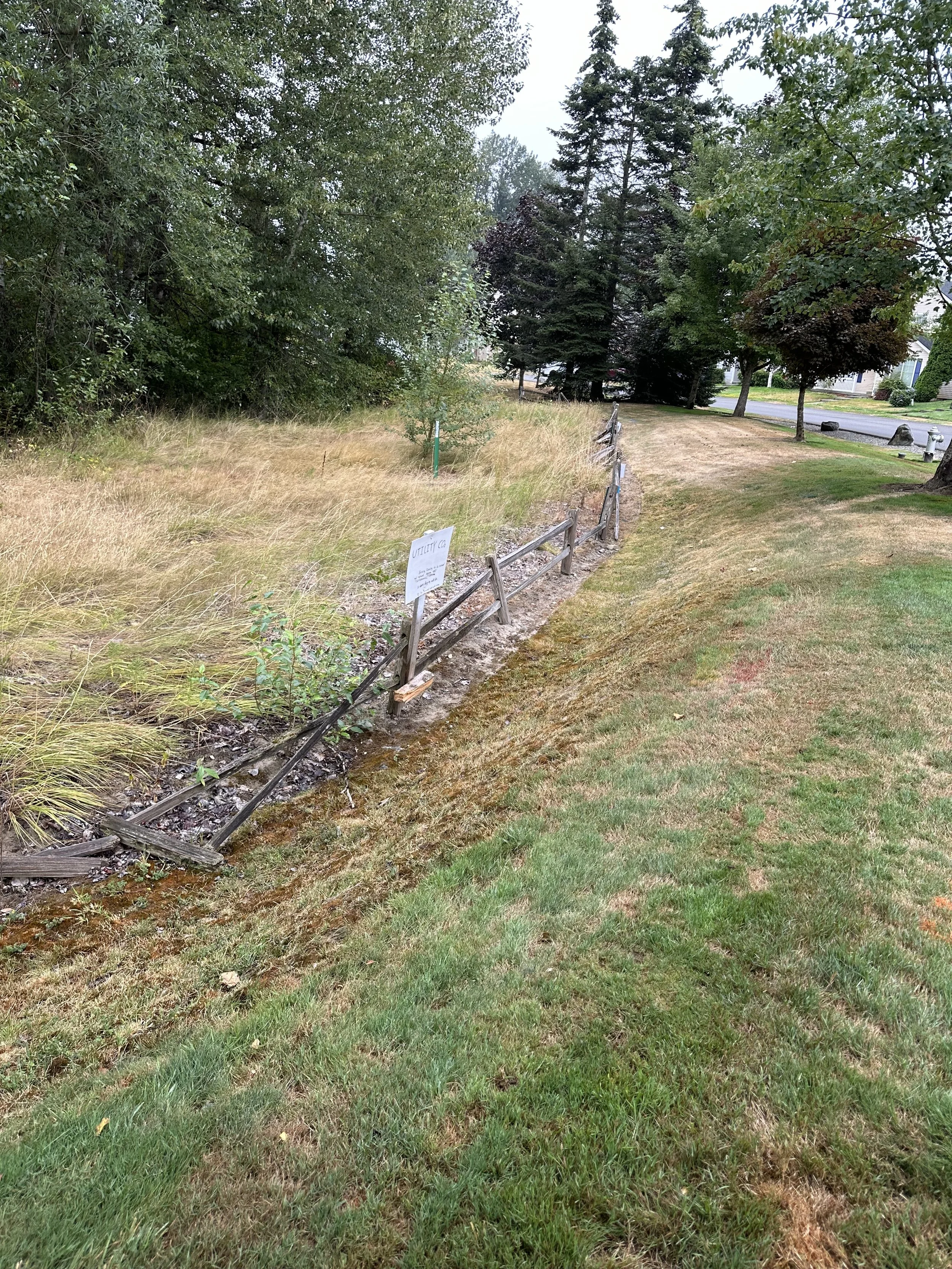 Another view of the deteriorated fence sections that needed to be fully removed before the new installation could begin.