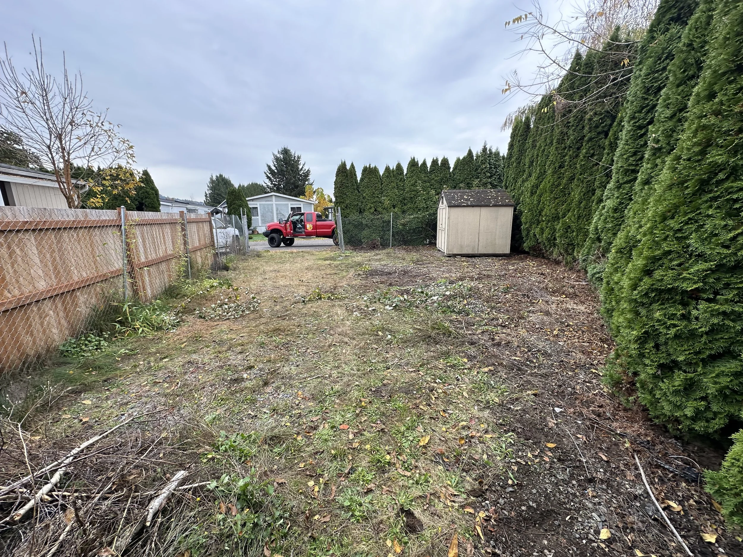 AFTER — Cleaned and leveled space ready for future parking conversion.