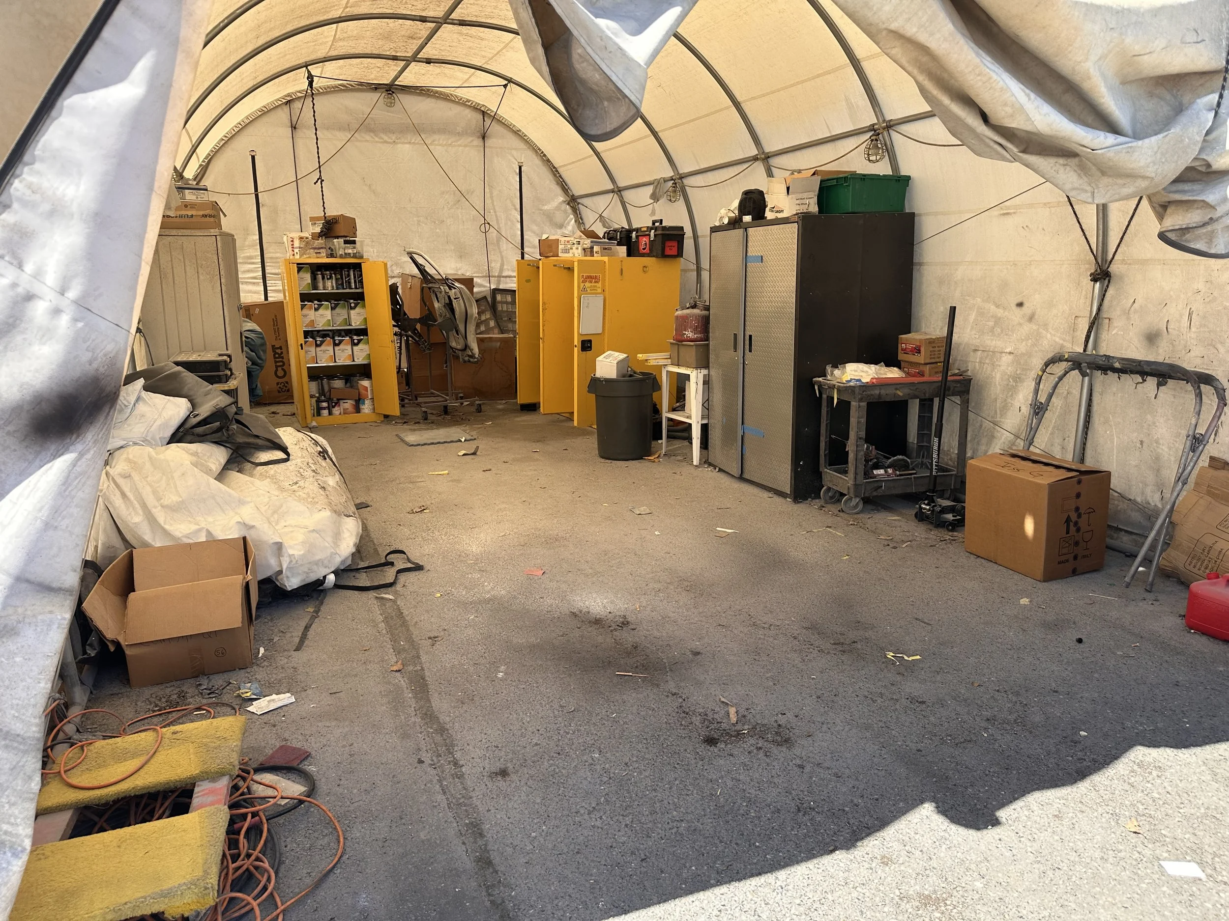 Cleared automotive work and storage area following a commercial junk removal project for Dent Wizard in Tukwila, Washington.