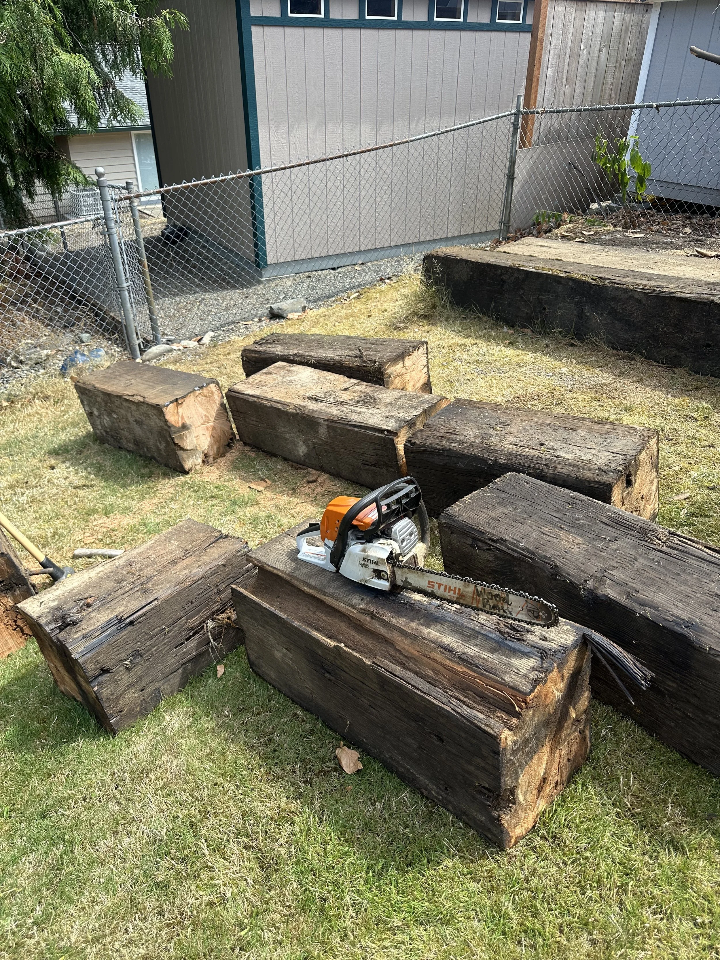 Progress — additional angle showing multiple beams cut into manageable sections.