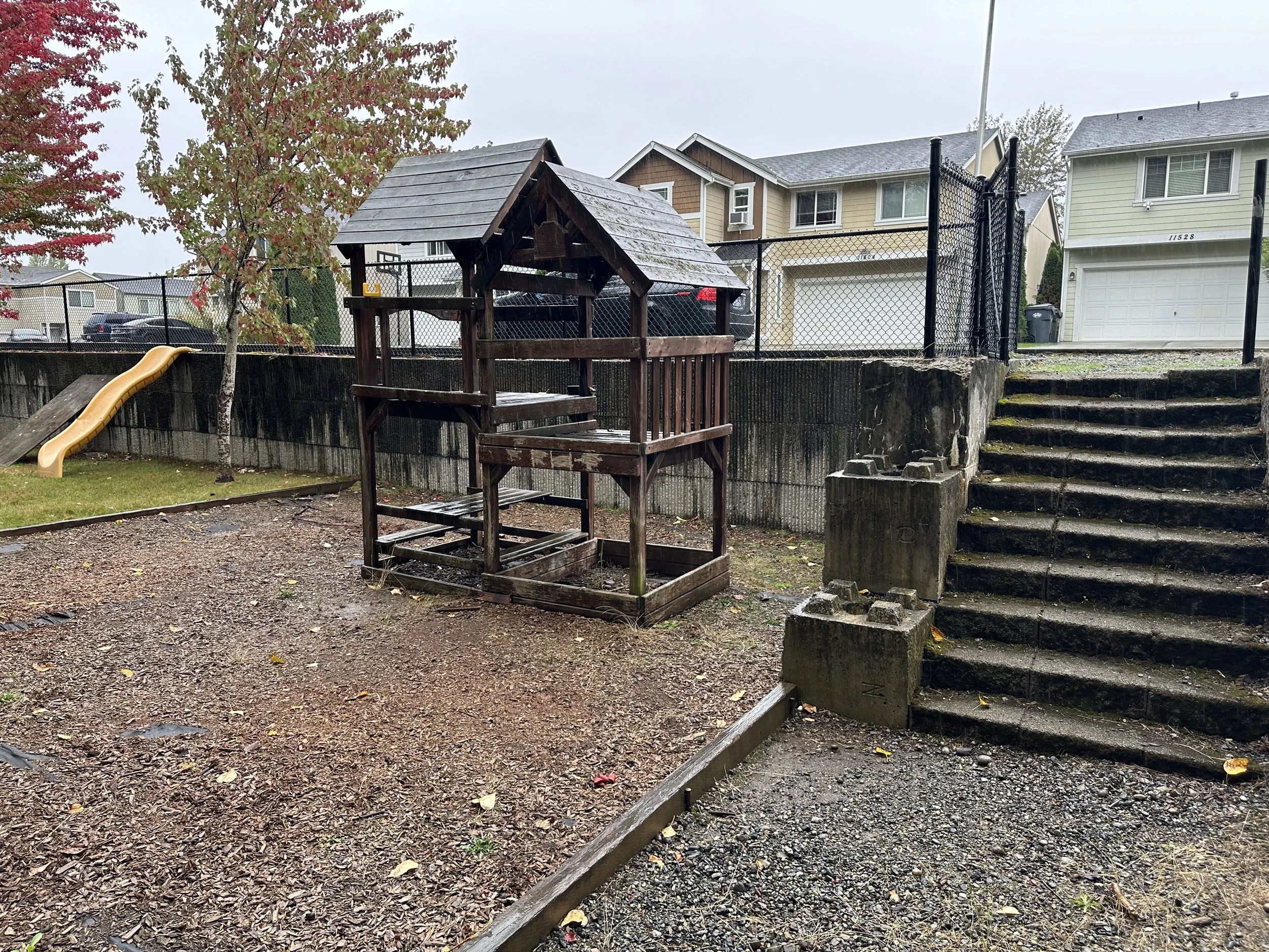 Before tear-out — Rotten and unsafe wooden play structure needing full dismantle, Tacoma WA.