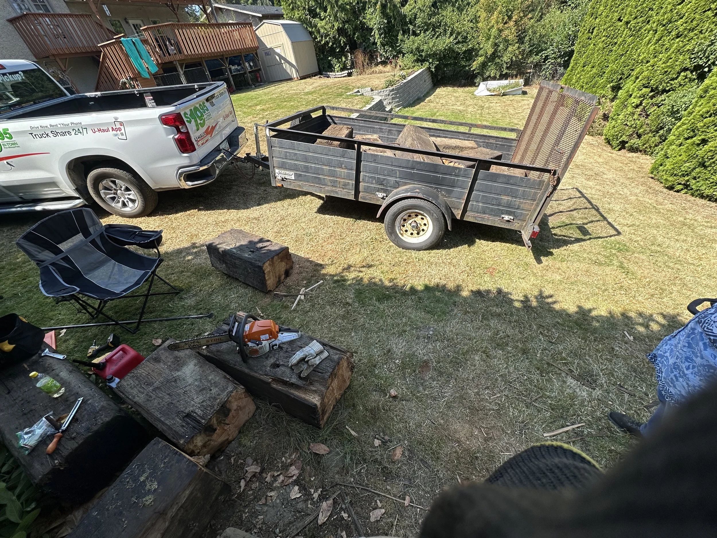 Loading — another angle of the fully loaded trailer with additional beam pieces in the foreground.