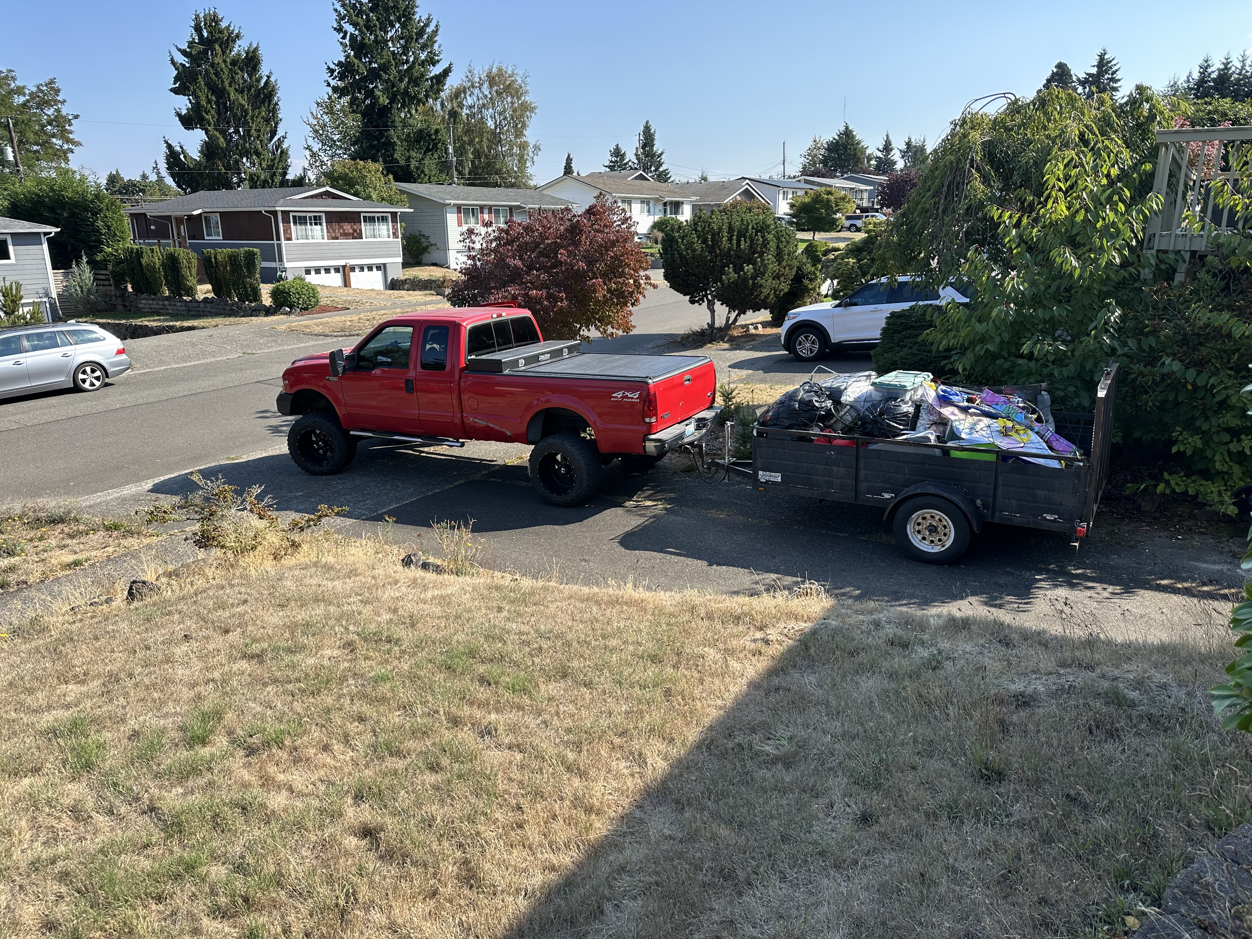 Full truck-bed loaded with mixed junk before dumping – Tacoma WA