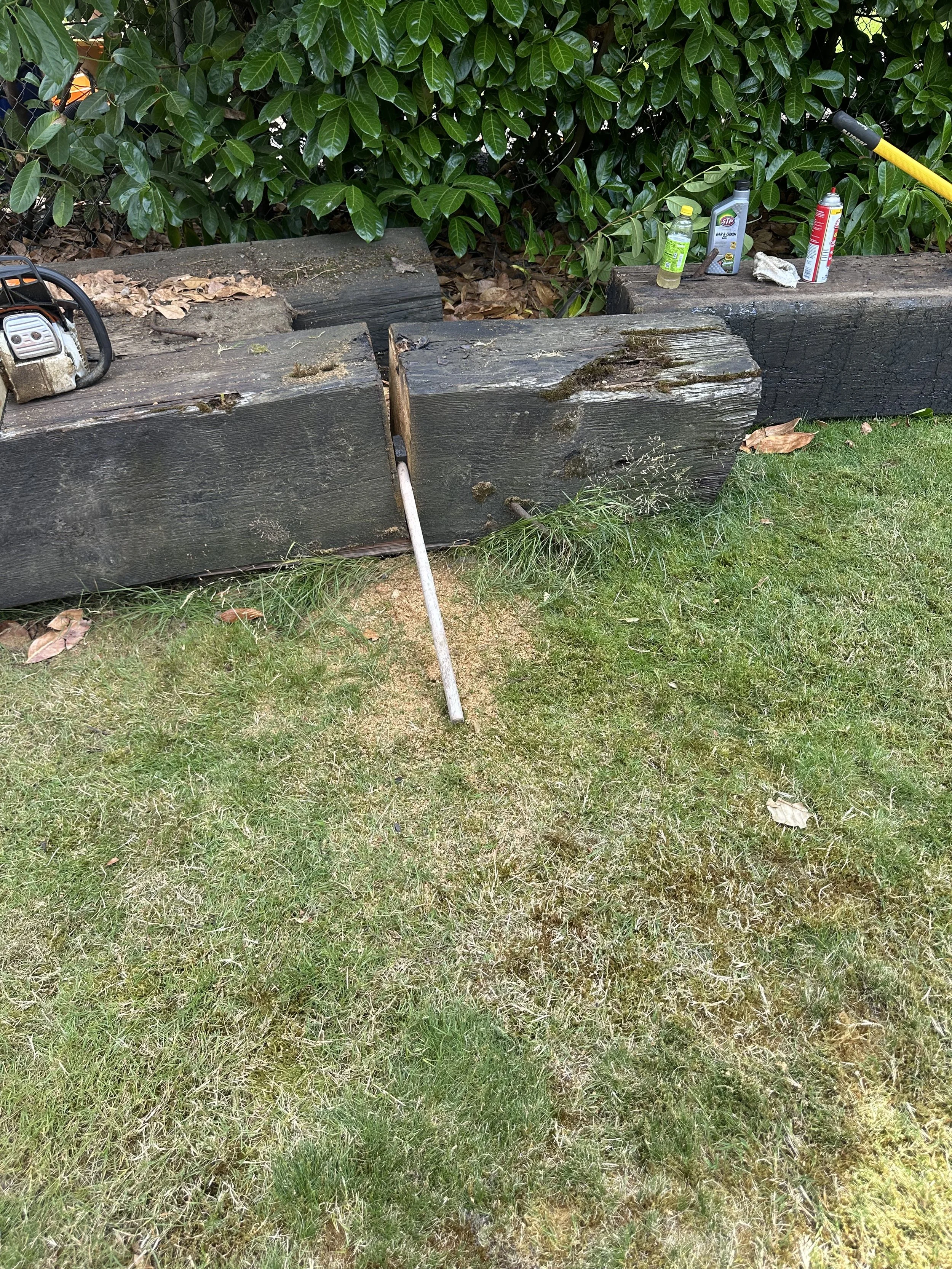 Progress — used an axe to split a stubborn beam before final cutting.