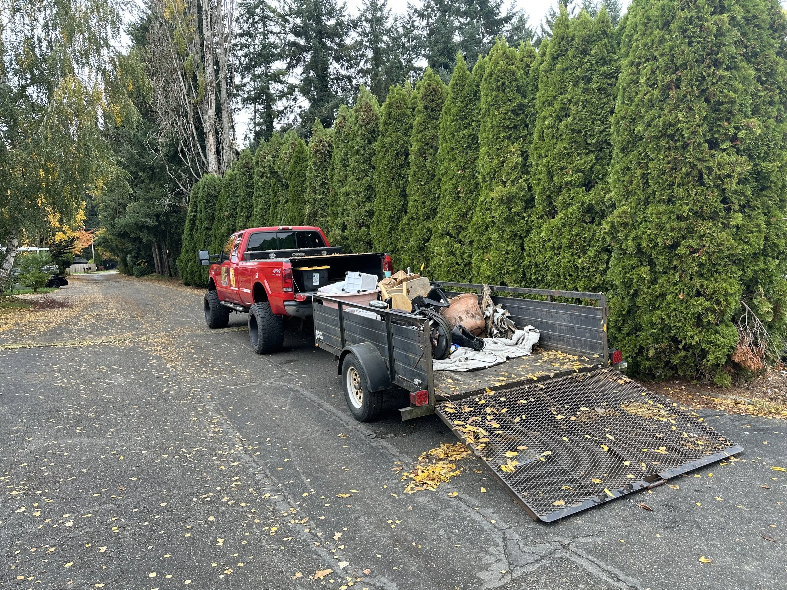 DAY 2 — Trailer filling up as more junk is cleared from the lot.