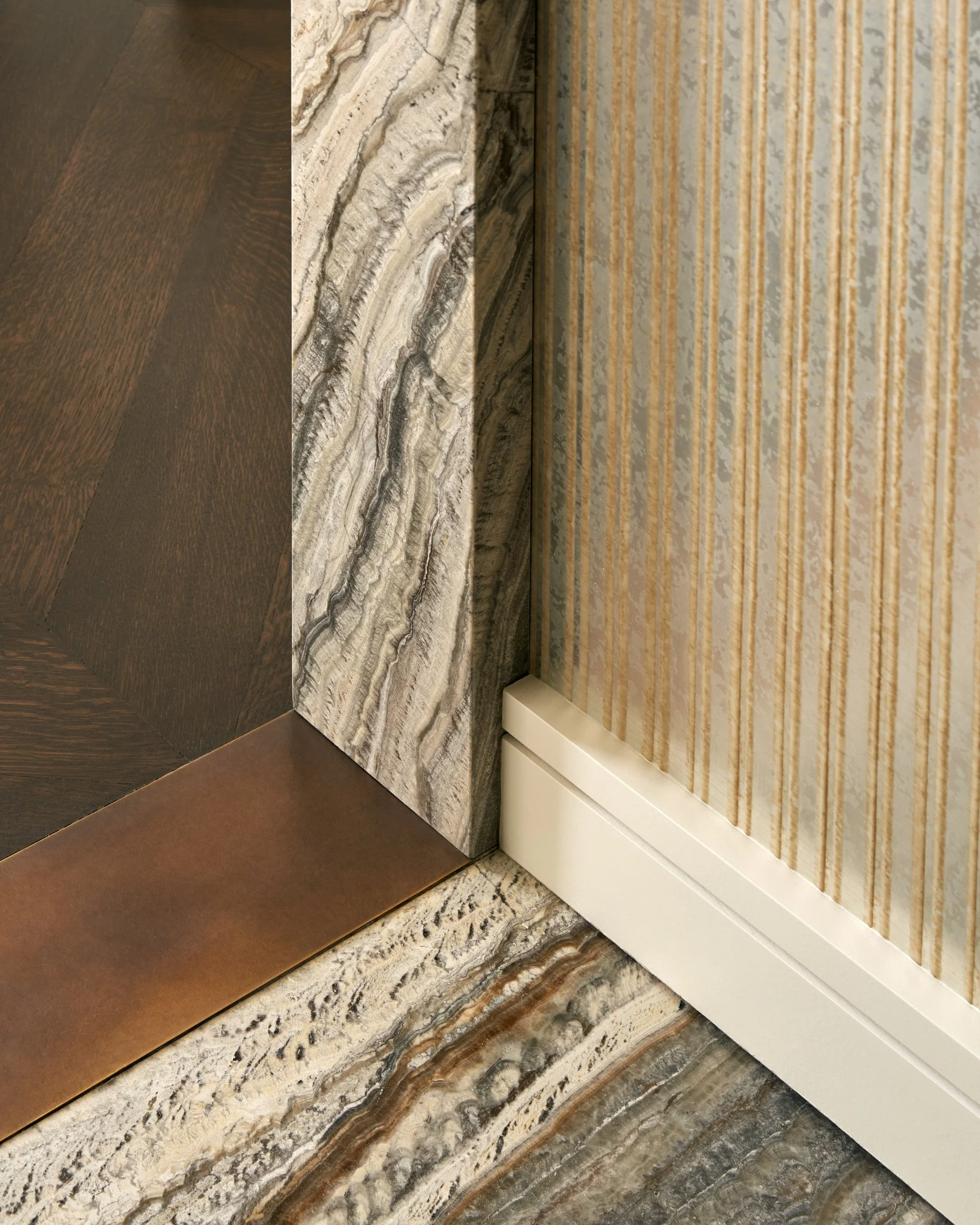 New-York-Renovations-Architecture-and-Interior-Renovation-West-18th-Marble-Floor-Bronze-Baseboard-Detail.jpg