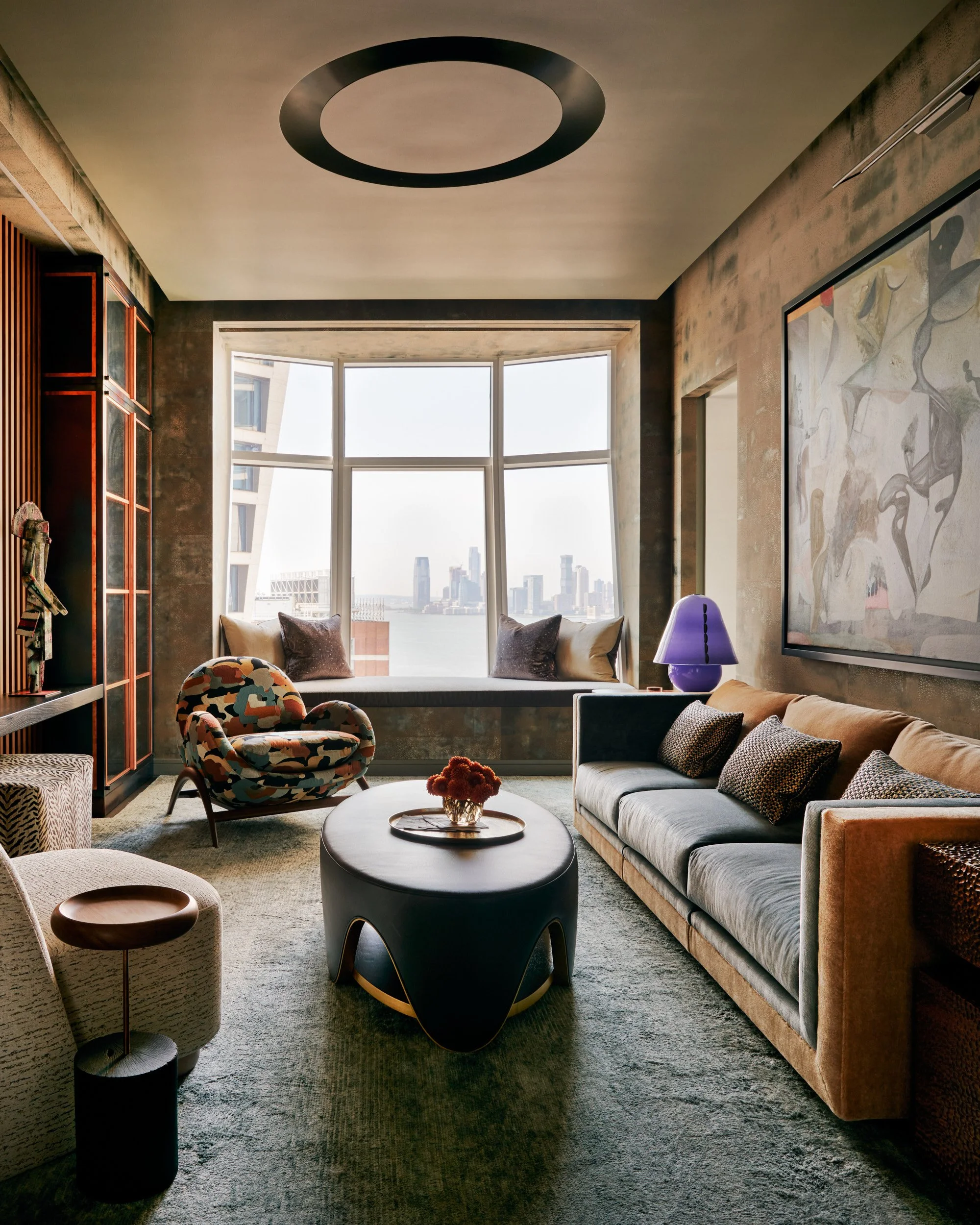 New-York-Renovations-Architecture-and-Interior-Renovation-West-18th-Den-Velvet-Sofa-Dark-Walls-City-View.jpg