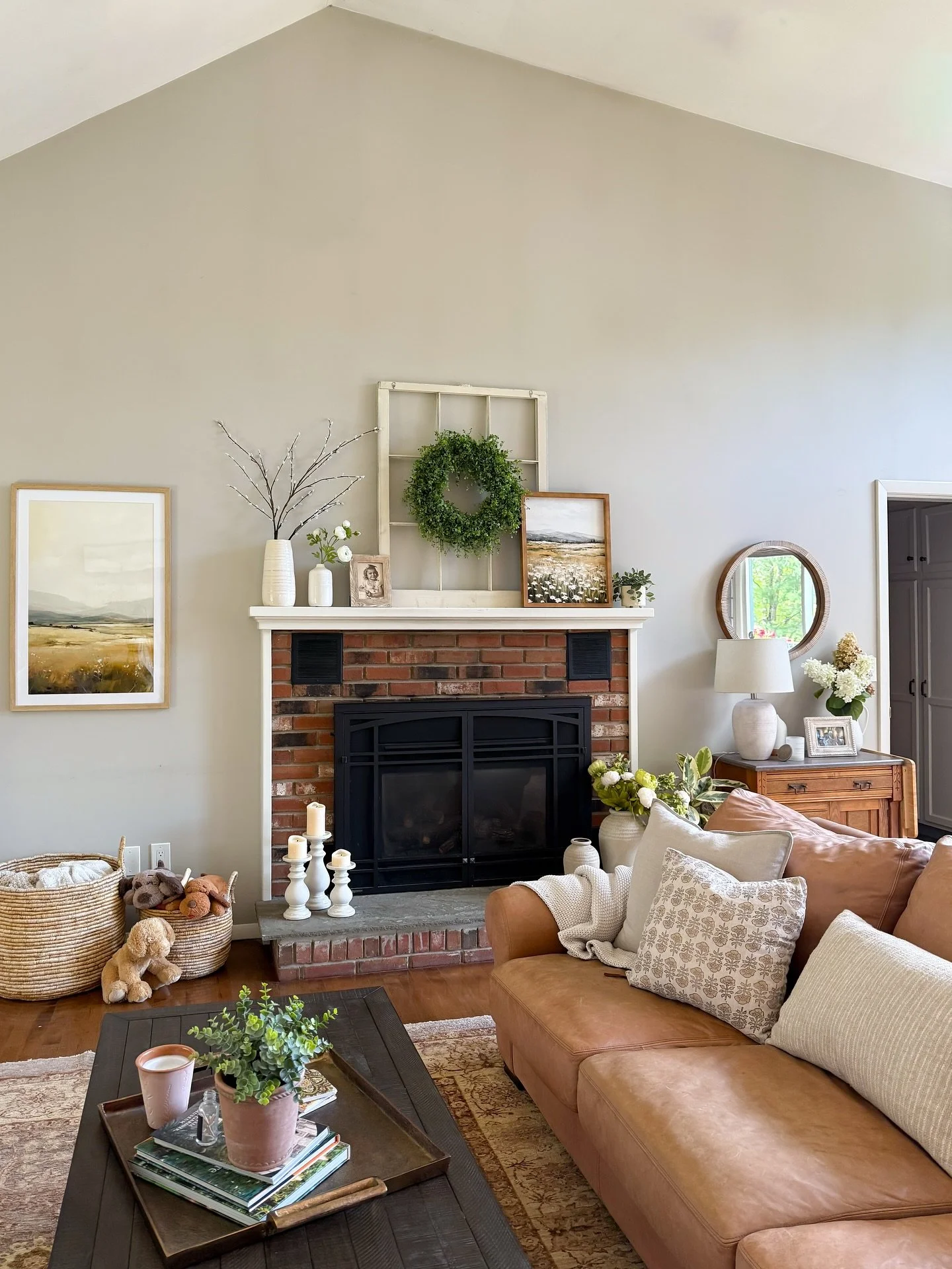 ✨ There&rsquo;s so much charm in this refreshed space! ✨

We kept the existing wool rug, leather sofa, and loveseat in the family room, then layered in new elements to soften and brighten the home: a smaller coffee table, updated artwork, and cozy de
